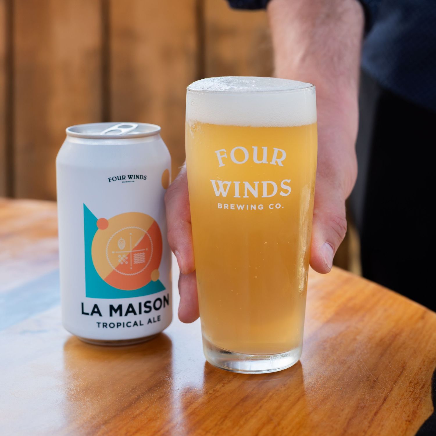 photo of a beer in a glass with the can beside it