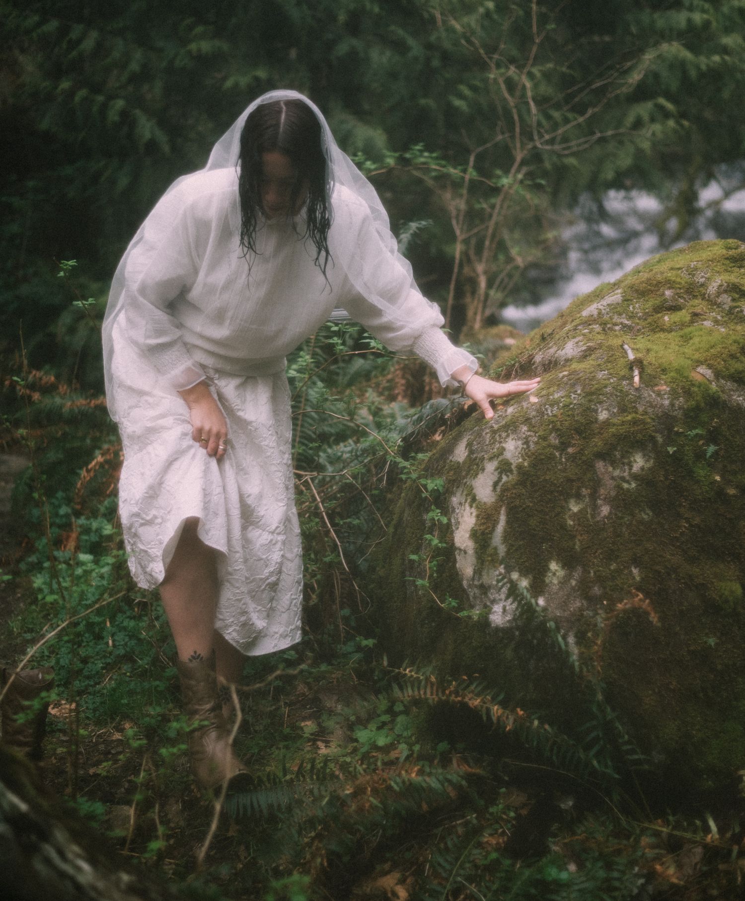 a woman standing in nature.
