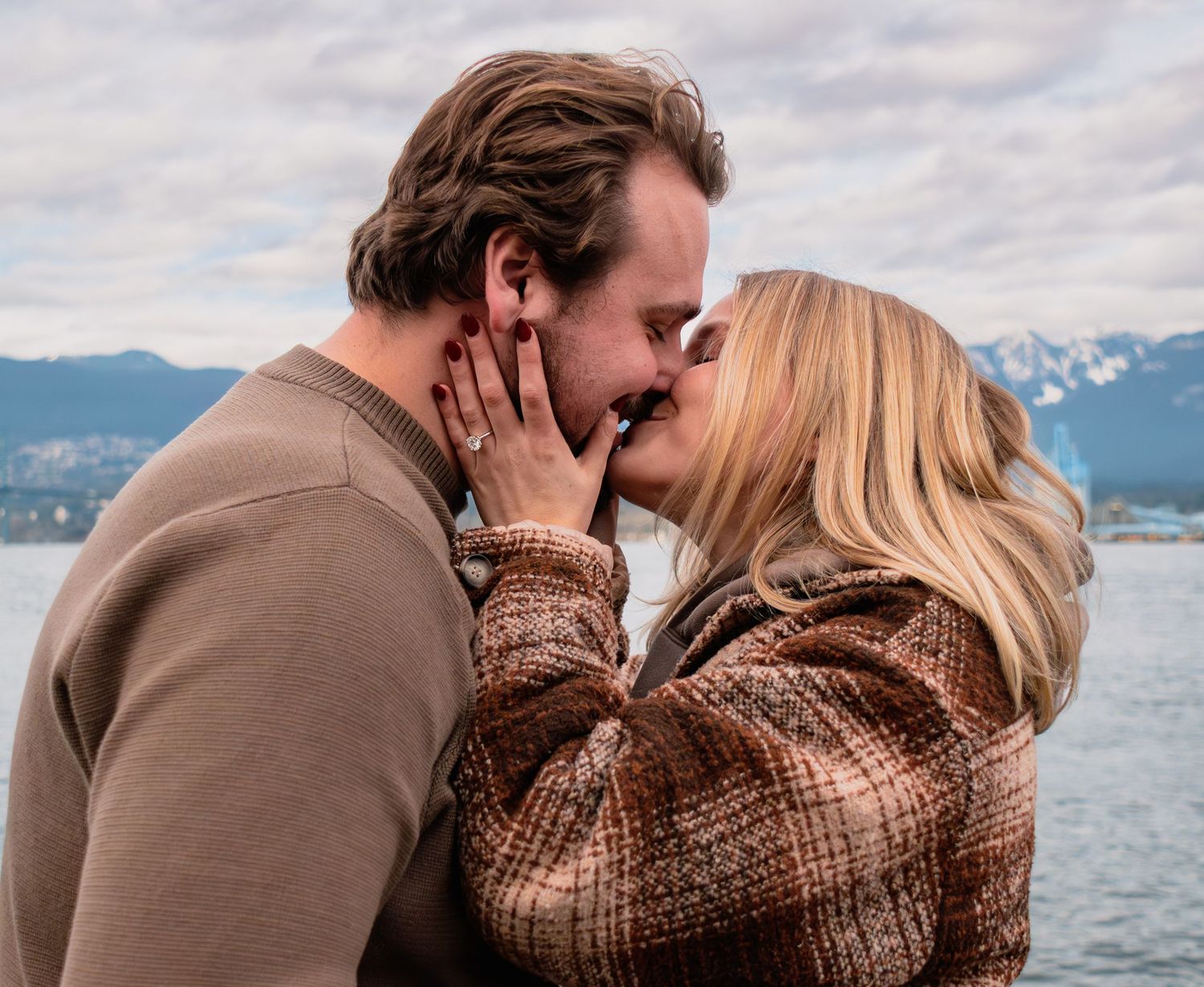 man kissing woman after proposing