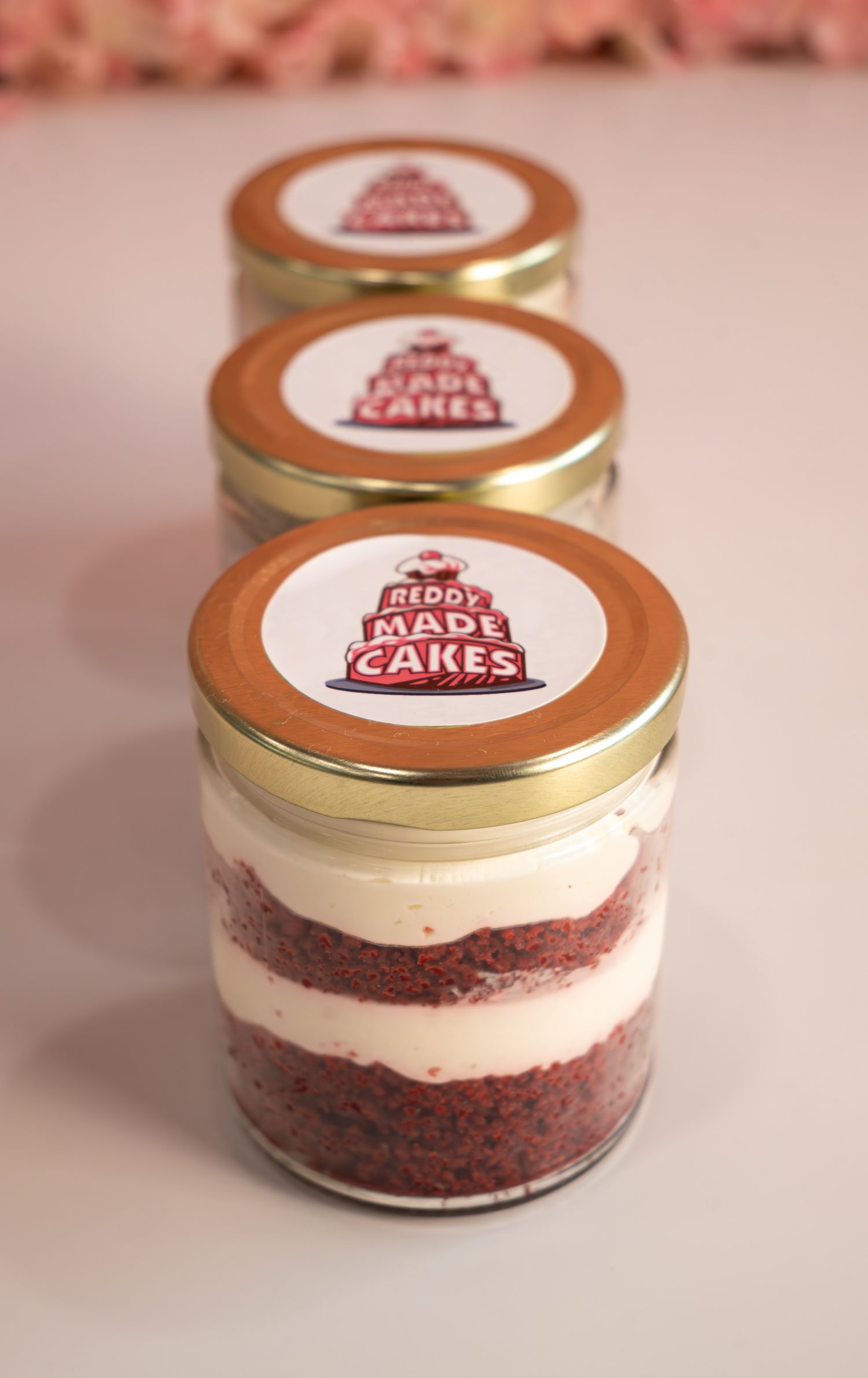 three cake jars lined up.