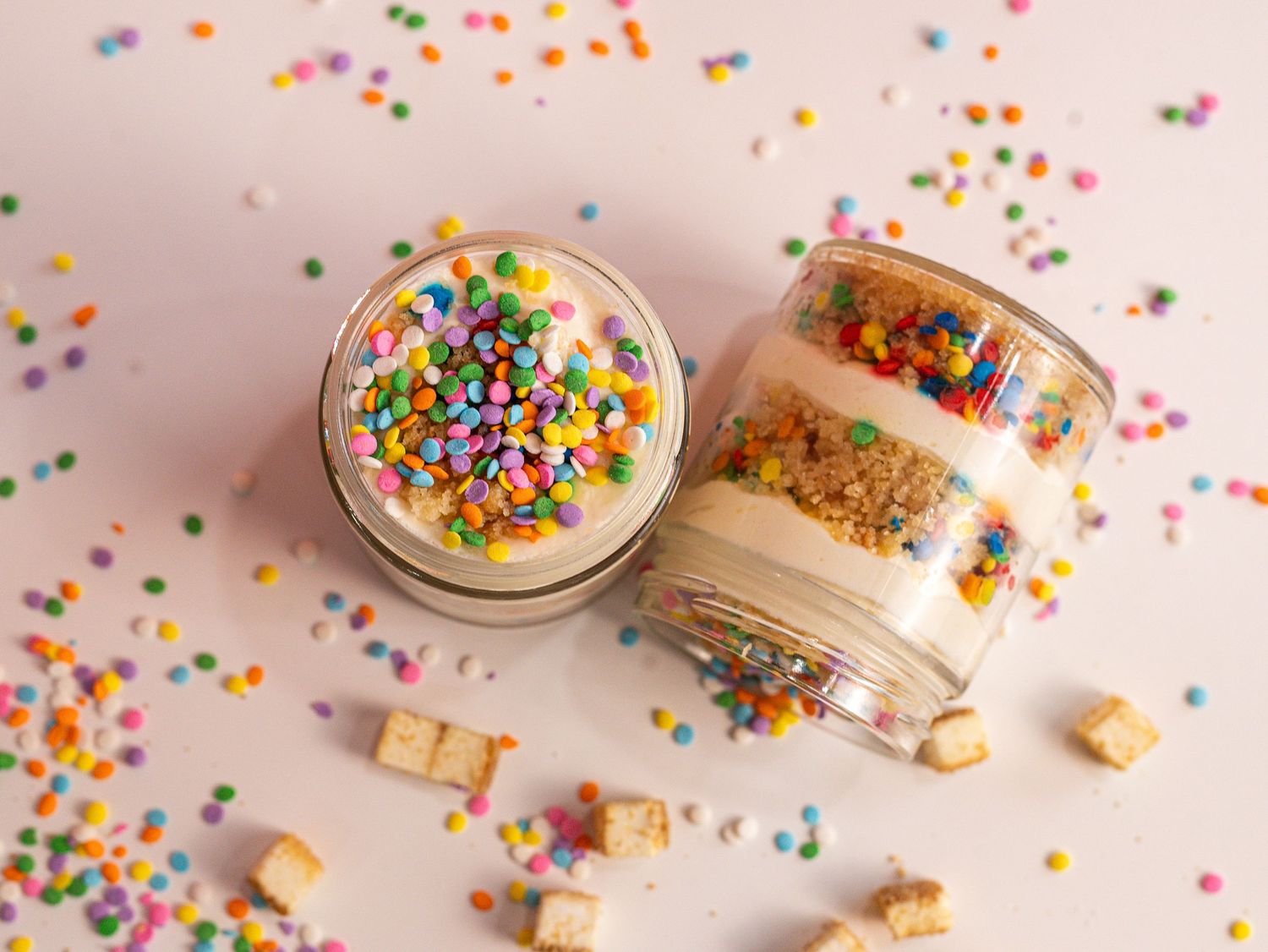 a colourful photo of a birthday cake cake jar with sprinkles everywhere