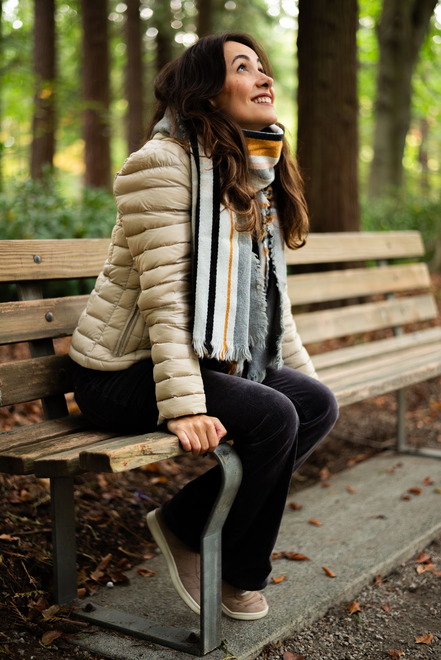 woman sitting on a bench smiling