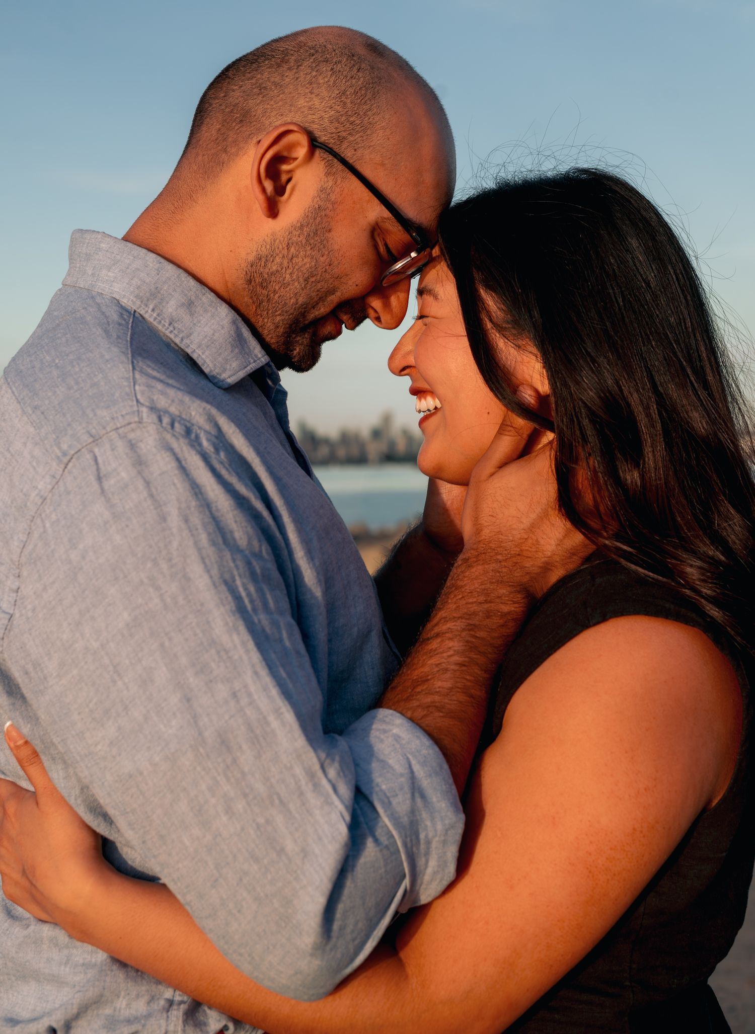 man and woman touching foreheads
