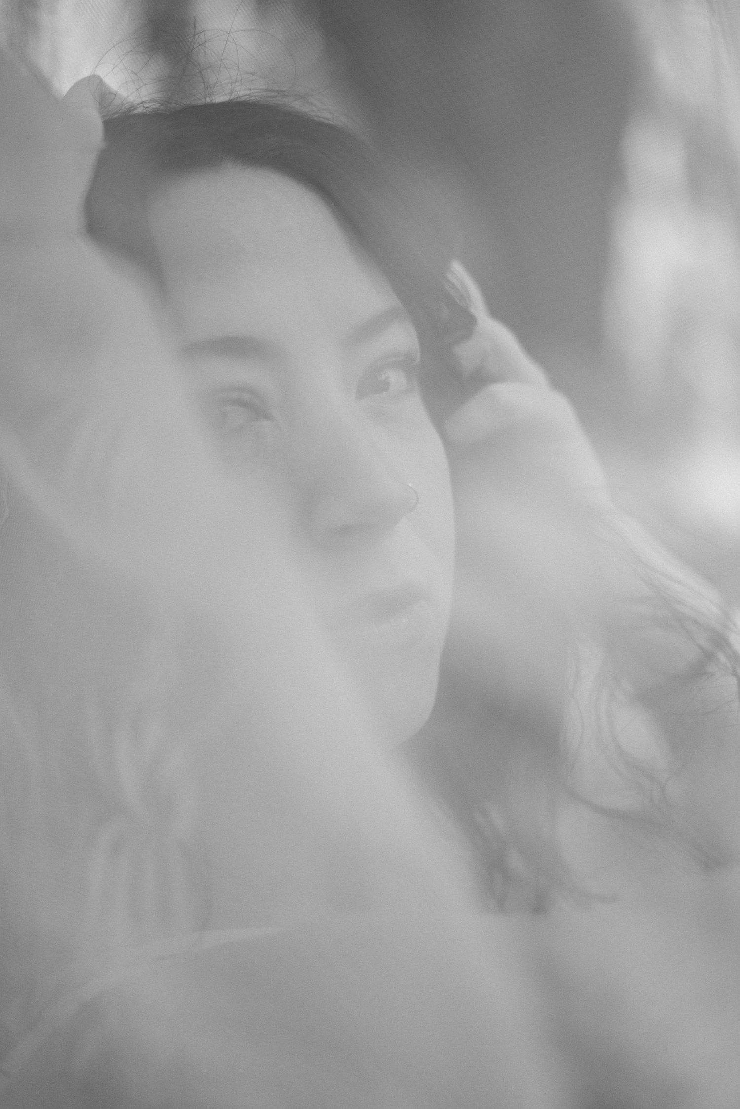 a black and white blurred photo of a woman.
