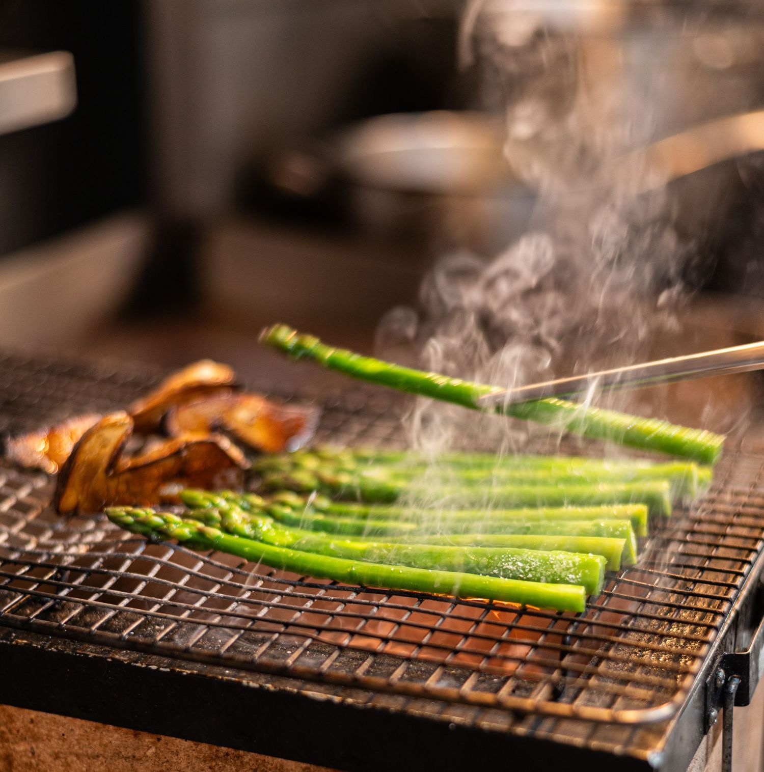 man grilling asparagus