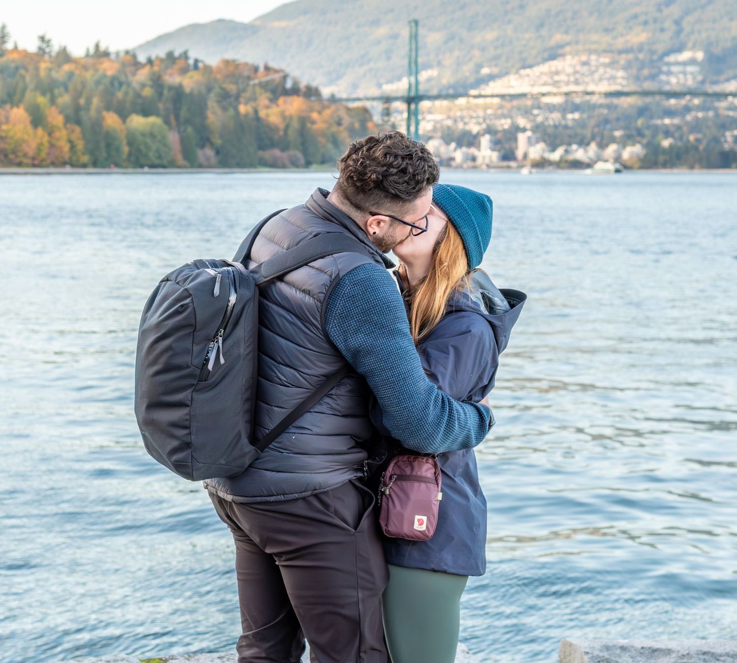 man kissing woman