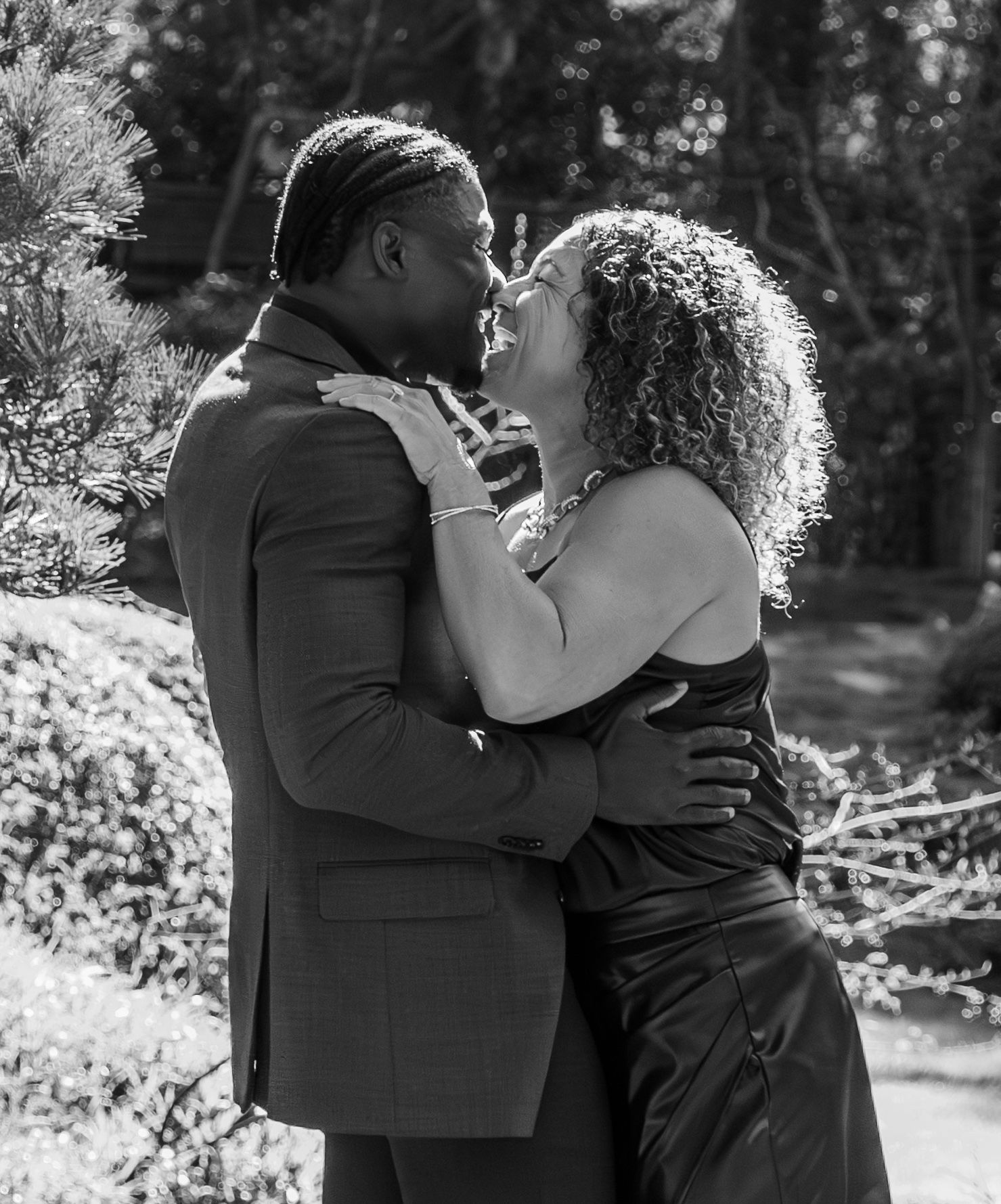 man and woman smiling and kissing