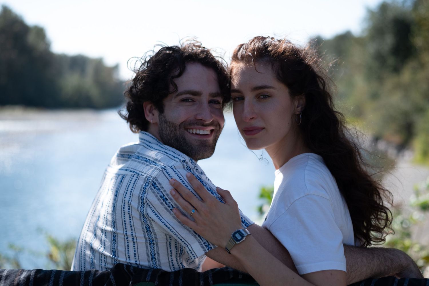couple posing on bench