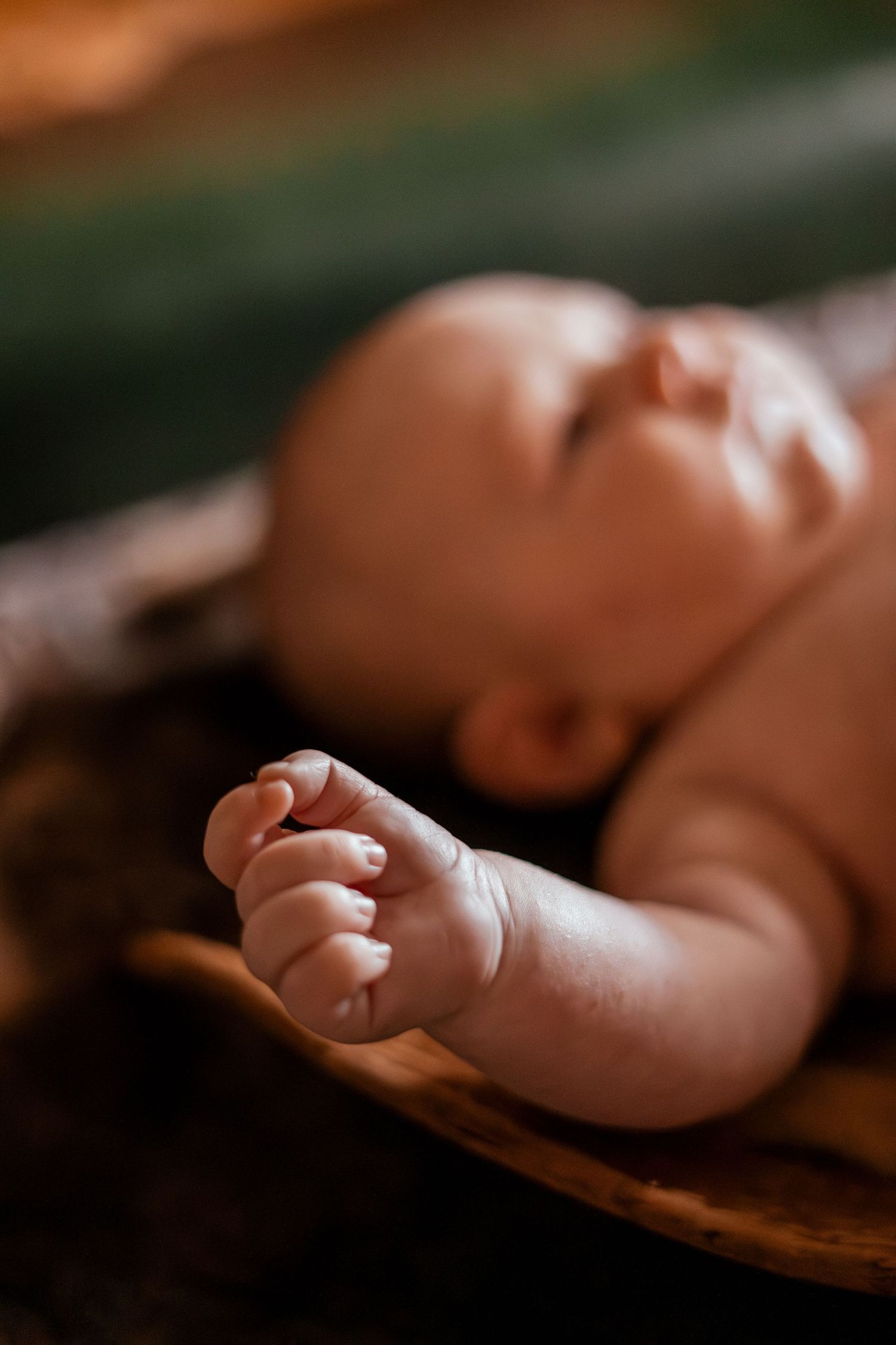 Close-up macro photography series showing tiny newborn baby feet resting in gentle hands.