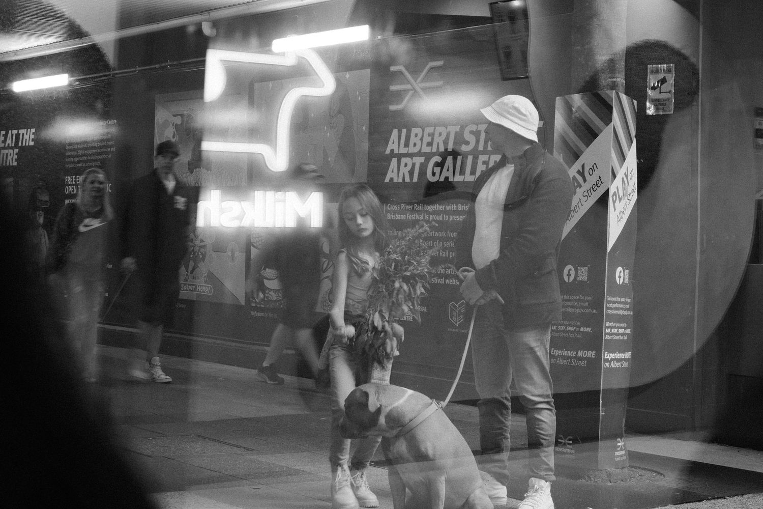 family, father and daughter,  A perfect blend of natural light,  Candid street photography capturing a raw and authentic urban moment