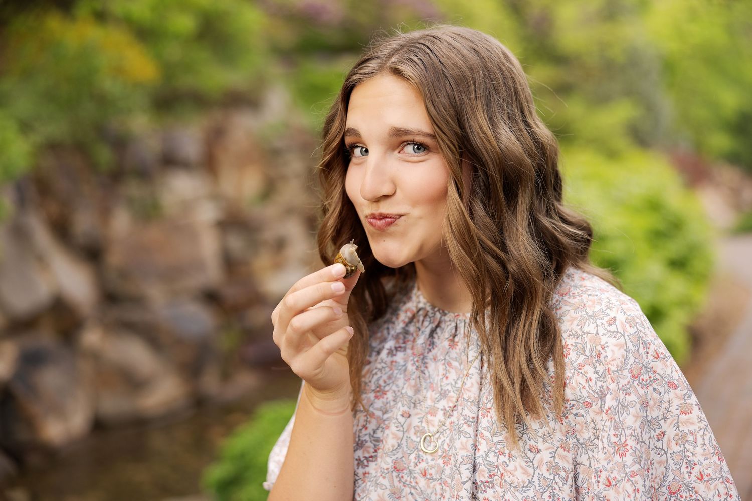 Portrait against natural background with soft glowing light.