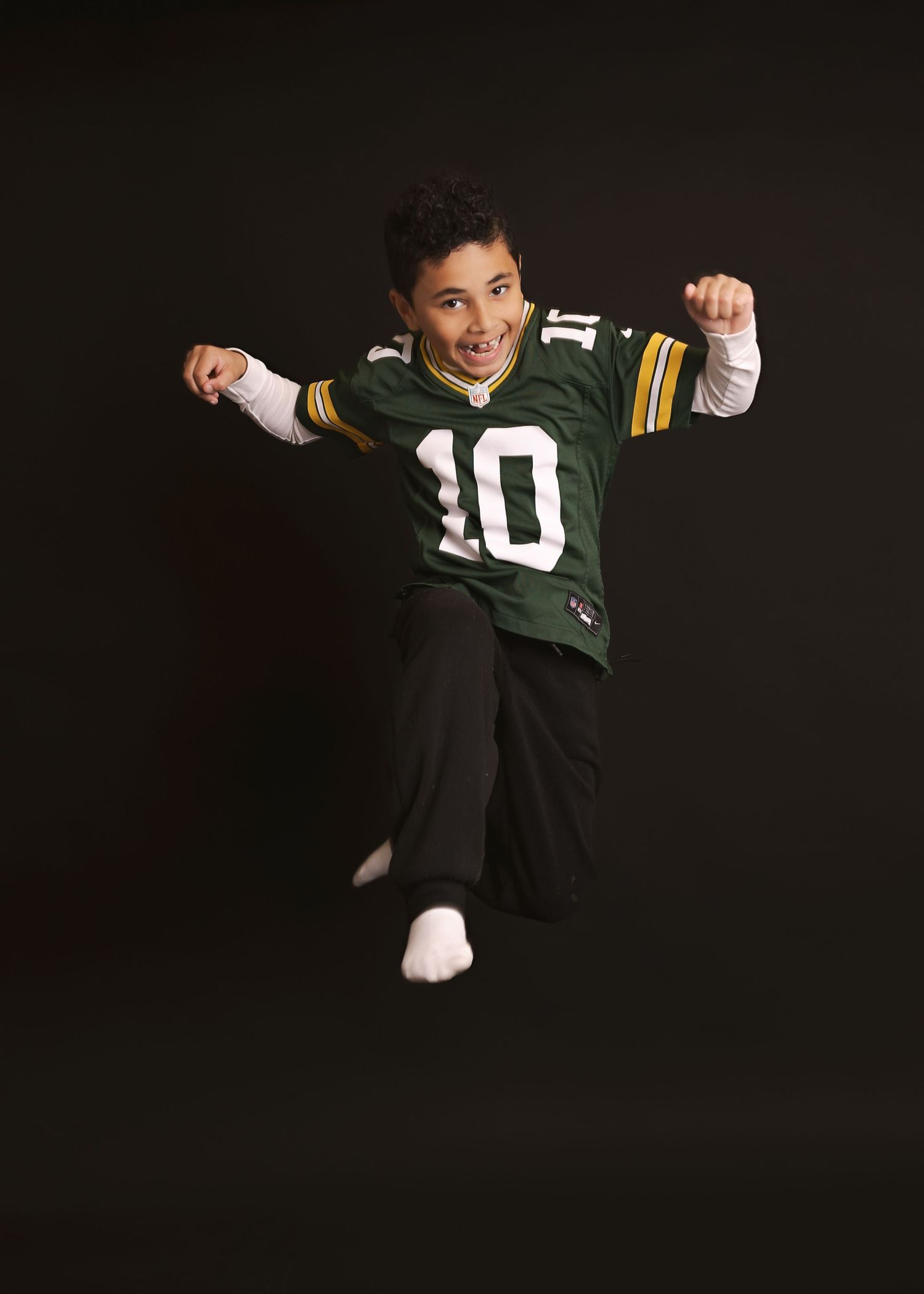 A sequence of photos shows a person in a green number 10 jersey celebrating and posing with expressive gestures.