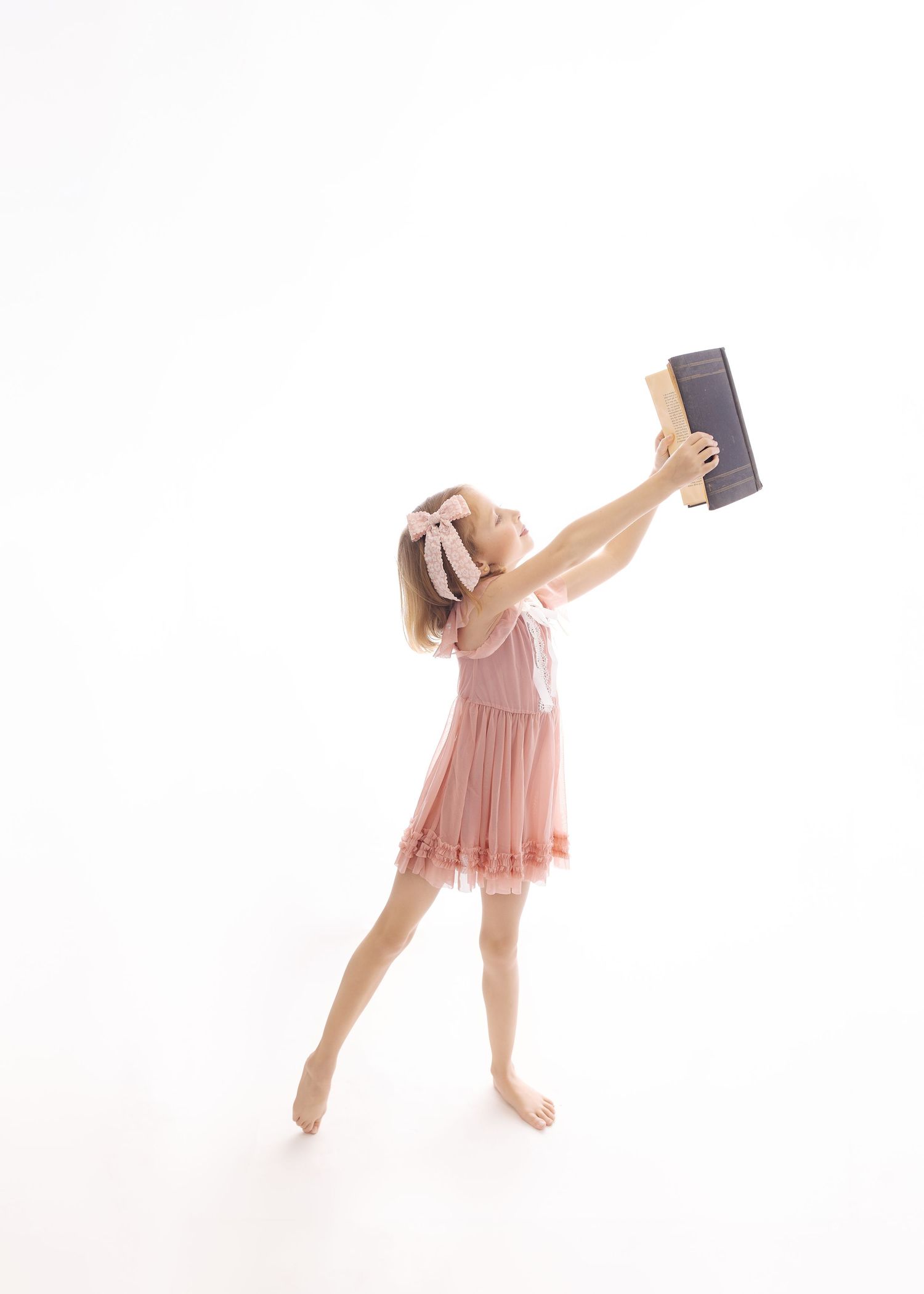 Five sequential dance poses in pink costume against white background showing graceful movement progression.