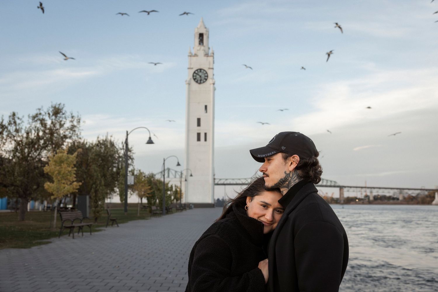 A series of romantic silhouettes against scenic backdrops with towers, bridges and waterfront views at sunset.
