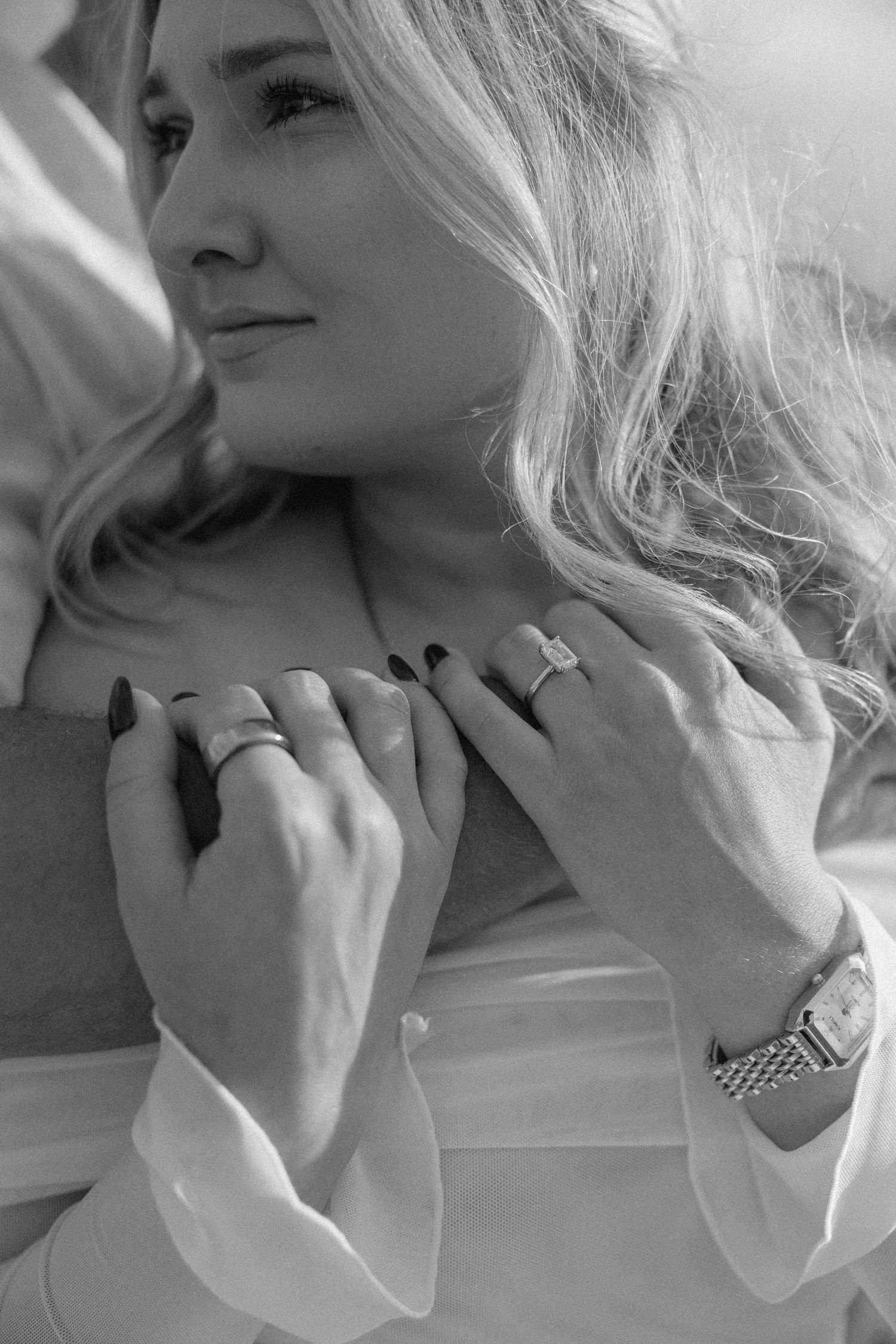 Black and white close-up portraits showing romantic expressions on a sailboat.