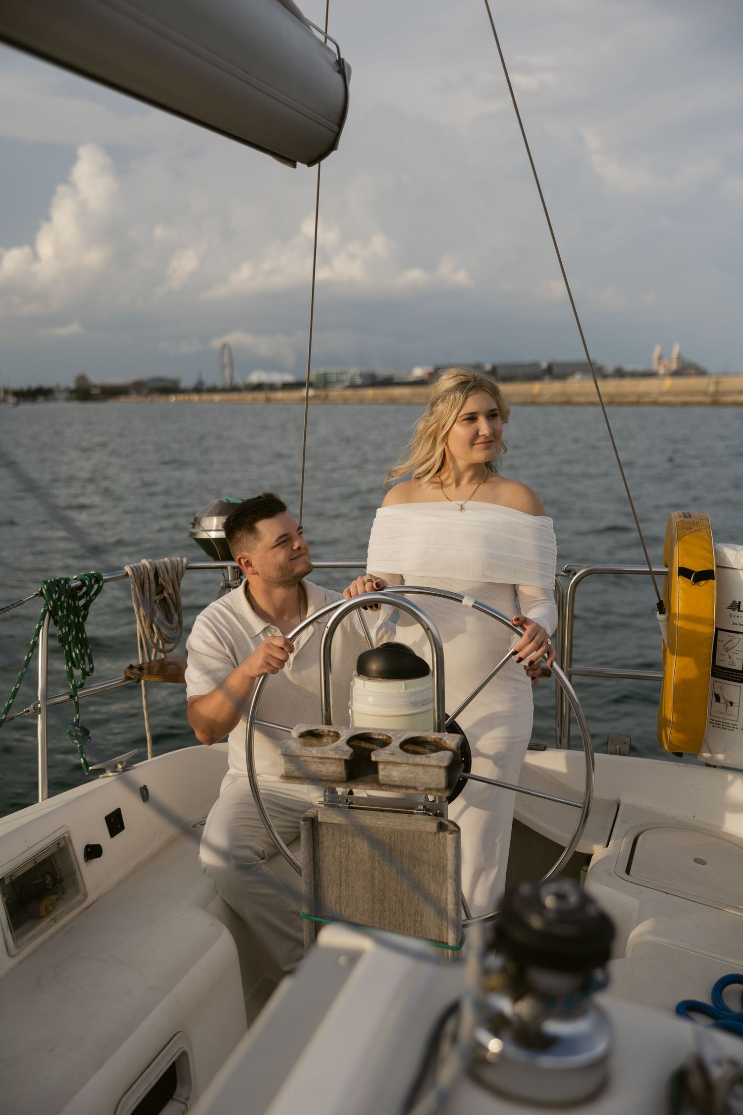 Series of photos showing a person enjoying a relaxed afternoon sailing on a yacht against a bright sky.