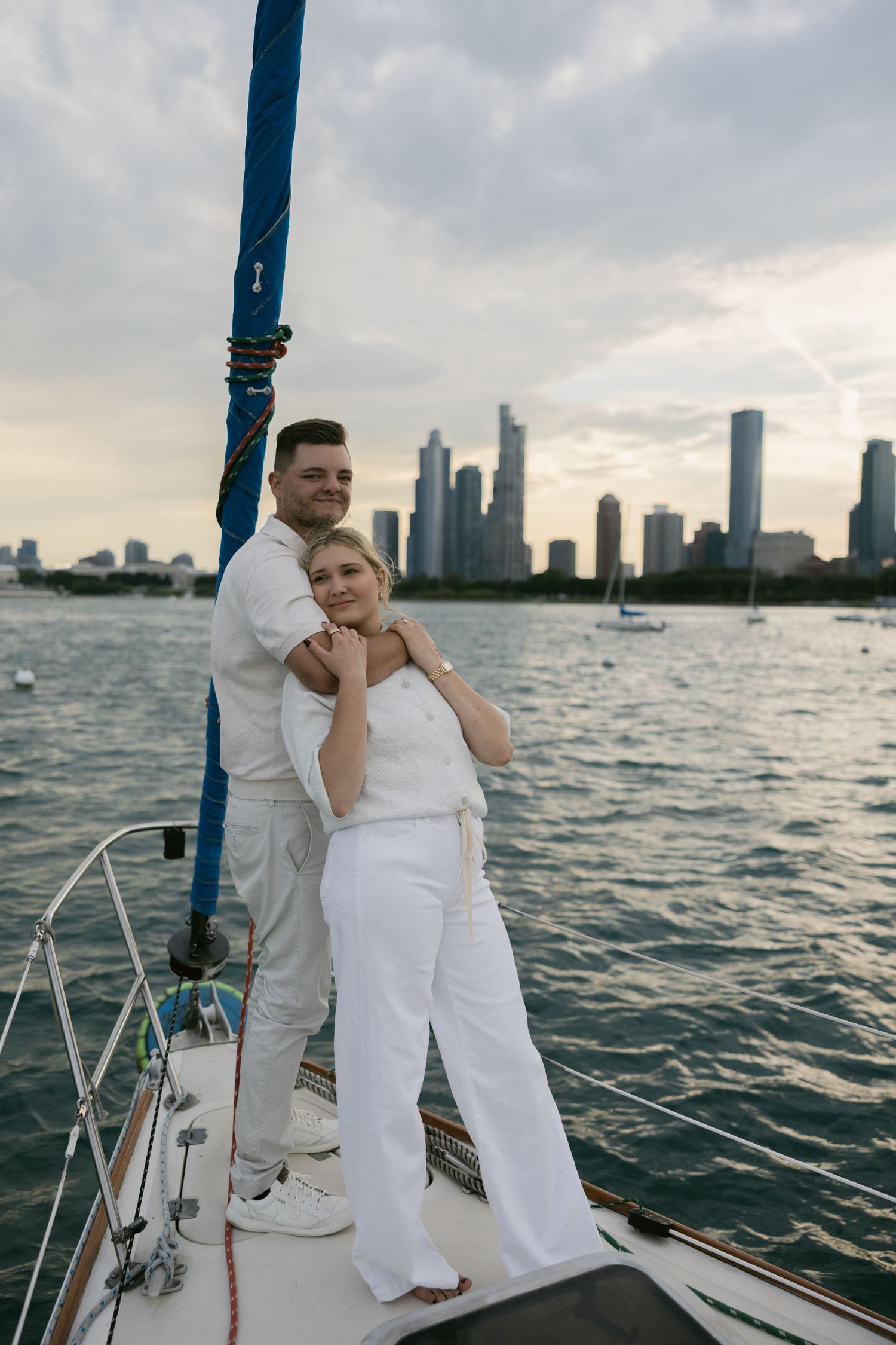 A romantic boat outing on Lake Michigan with the Chicago skyline in the background at sunset.