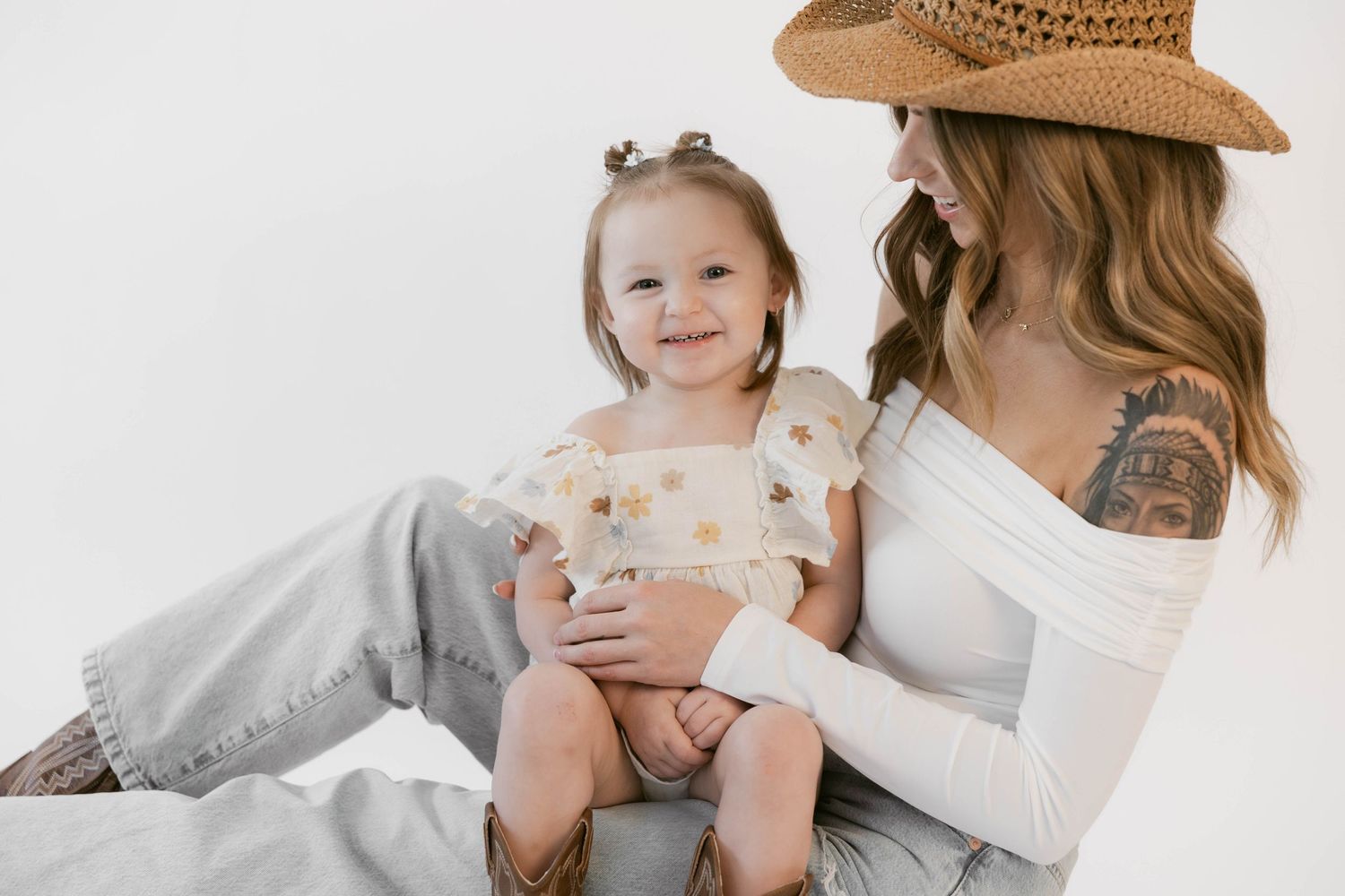 Sweet lifestyle portraits against white background showcase casual western style and tender moments.