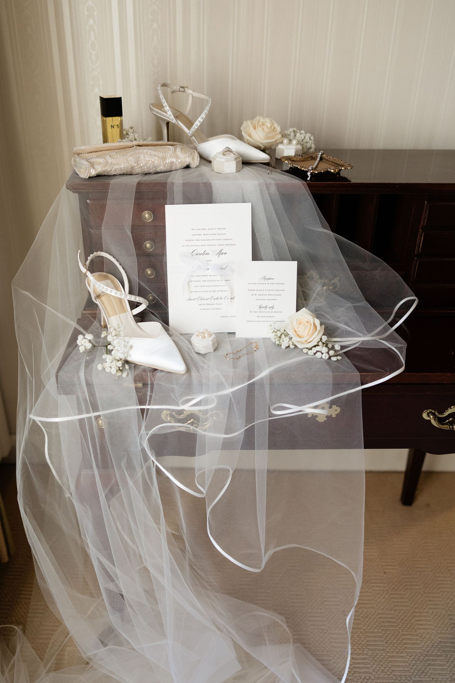 White bridal veil with delicate tulle fabric flowing across multiple frames in a wedding preparation setting.