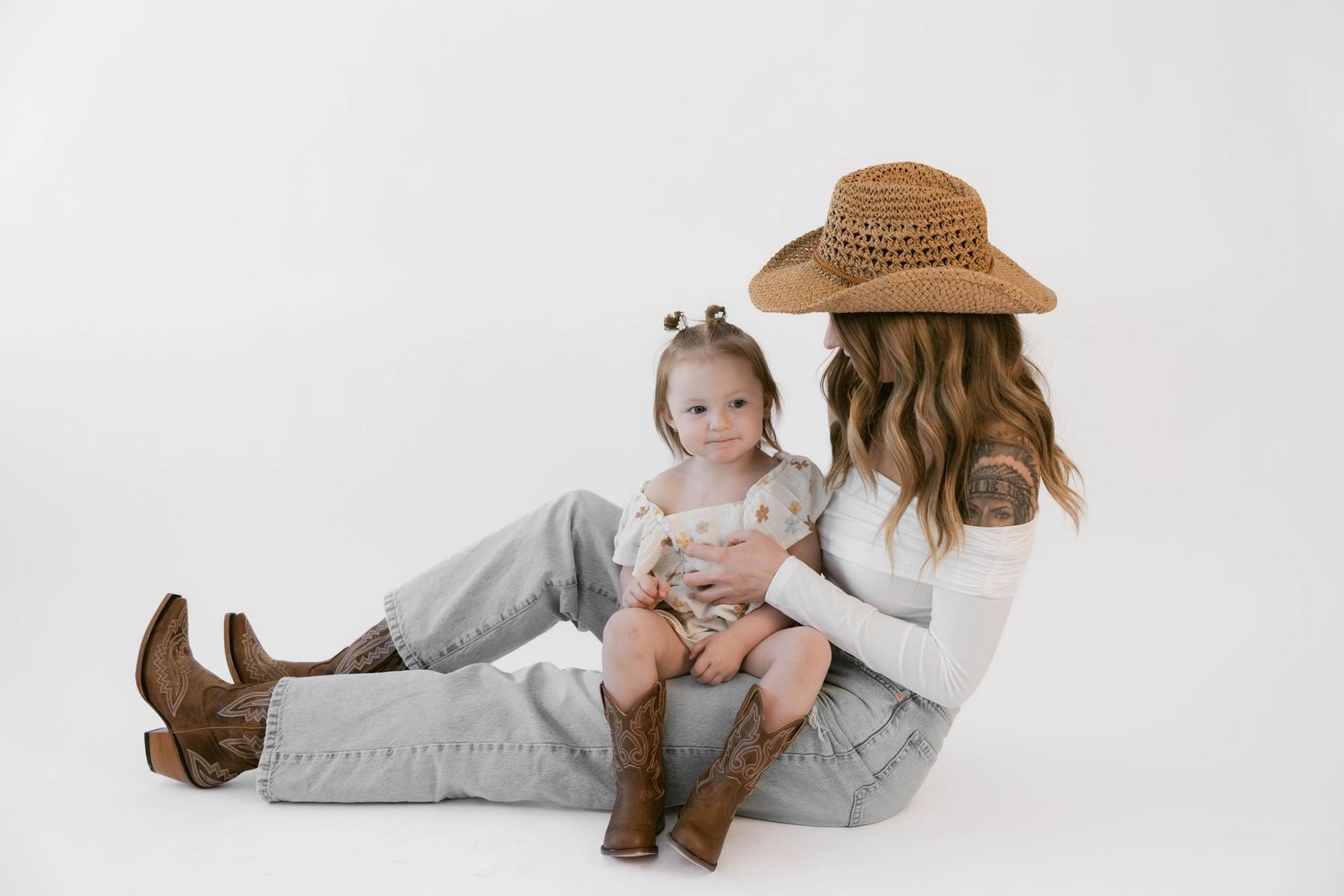 Lifestyle portraits showing affectionate interaction in casual western wear.