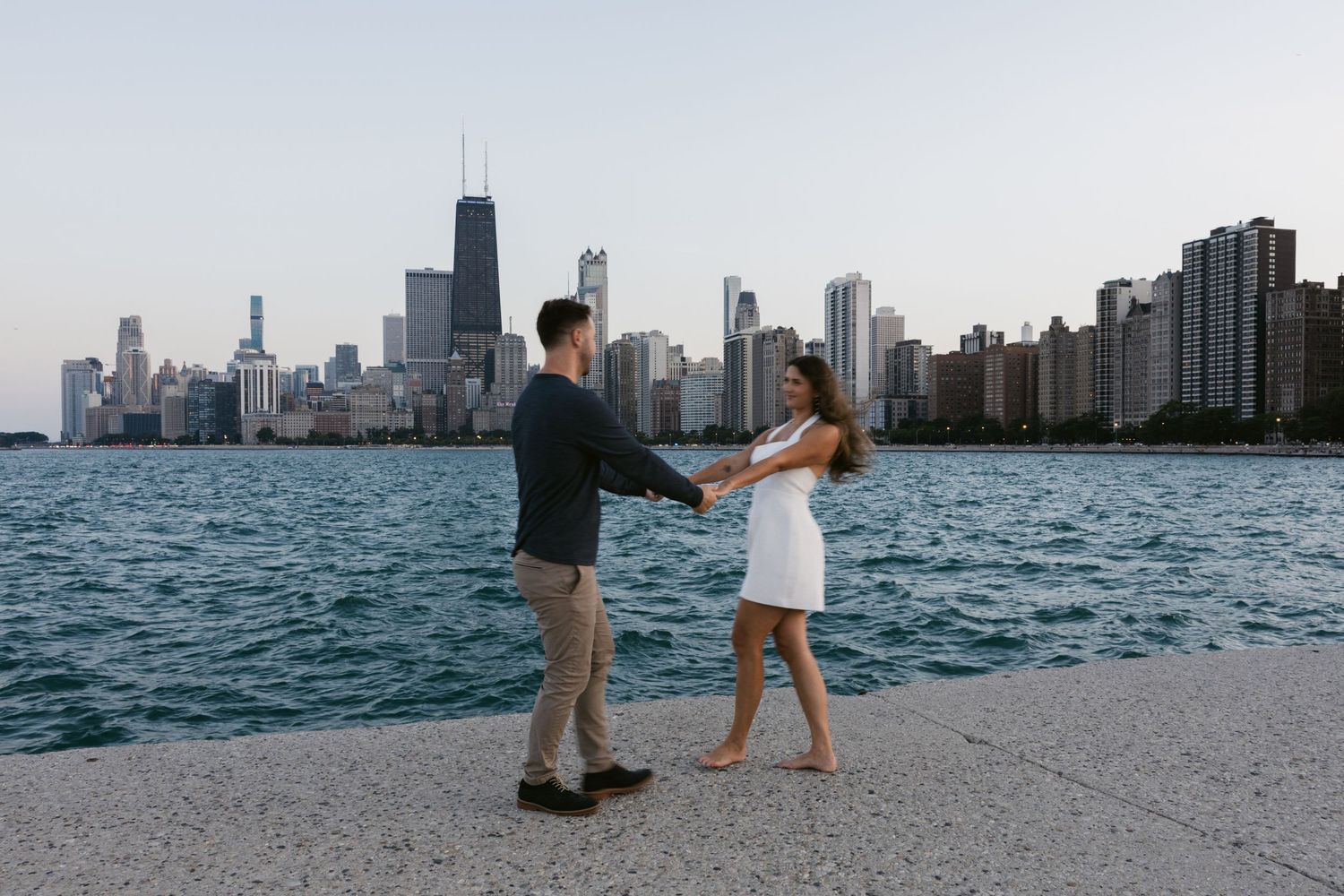 Lake Michigan shoreline scene with Chicago's urban skyline creating a dramatic backdrop.