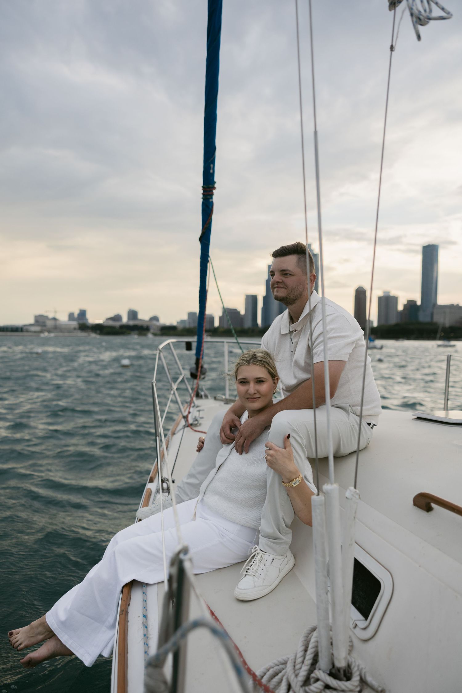 Peaceful boat outing with two people in white enjoying the waterfront views.