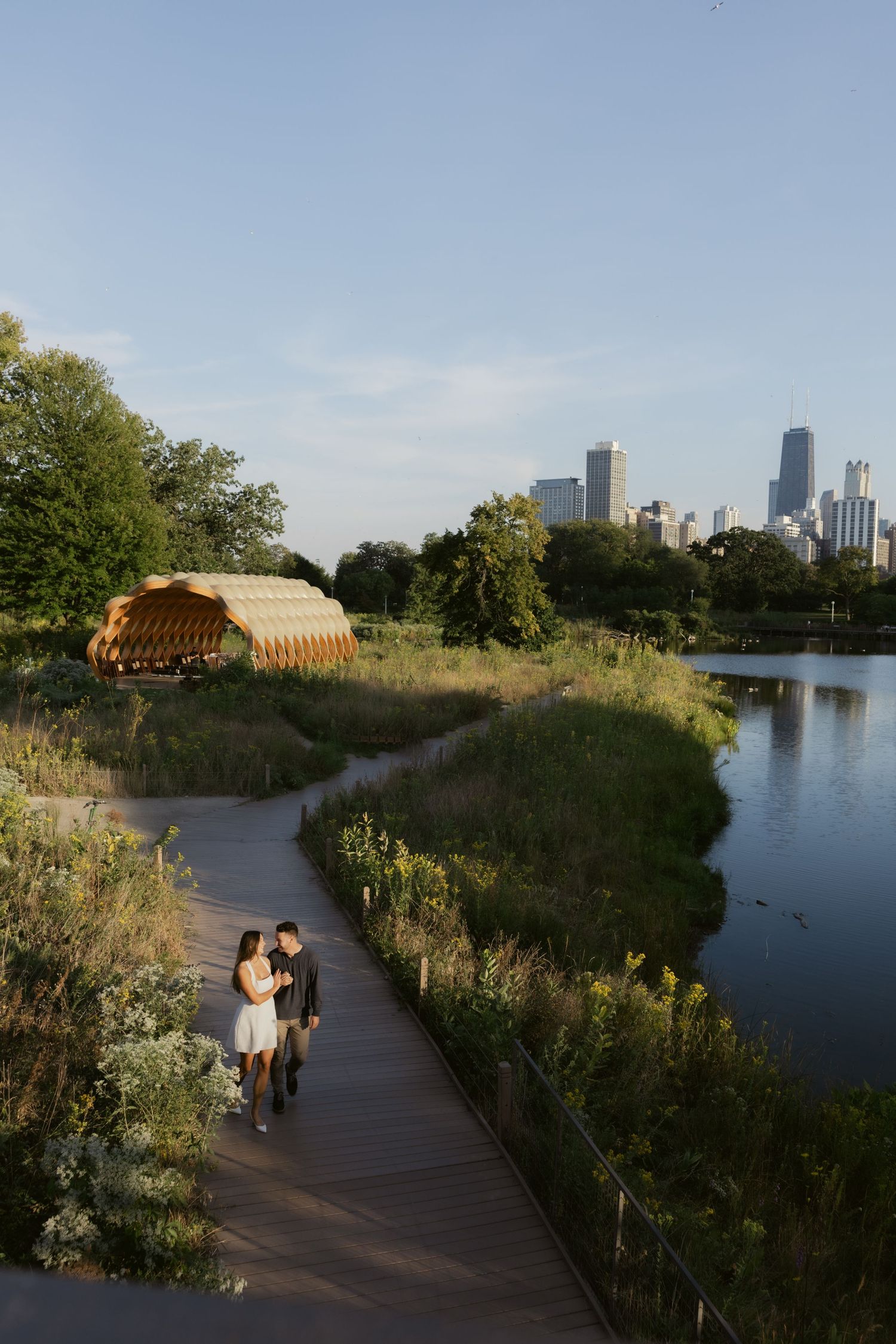 Walking along wooden boardwalk with lakeside views of downtown Chicago.