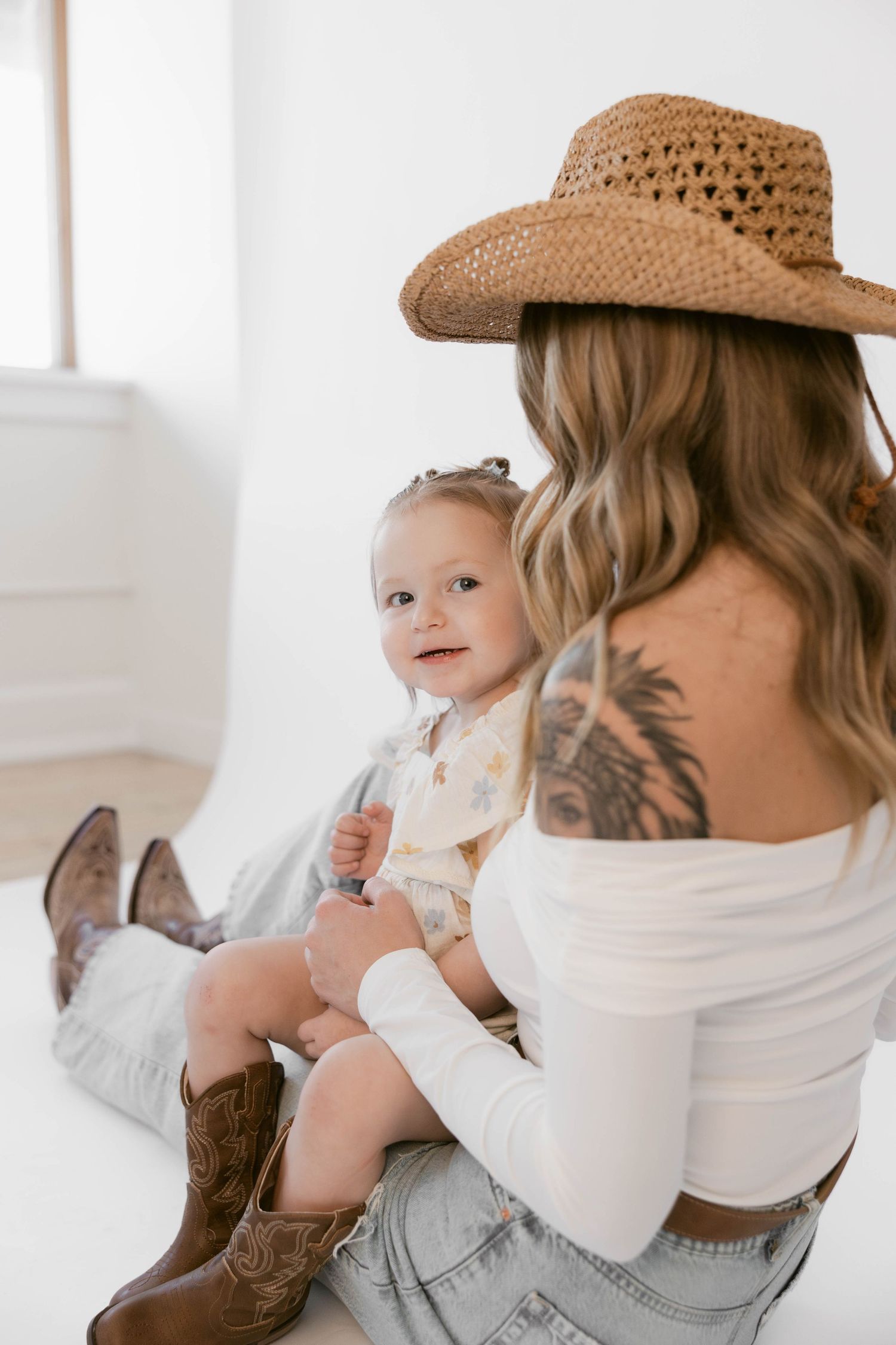 Lifestyle portraits with western flair feature casual poses against clean white backdrop.
