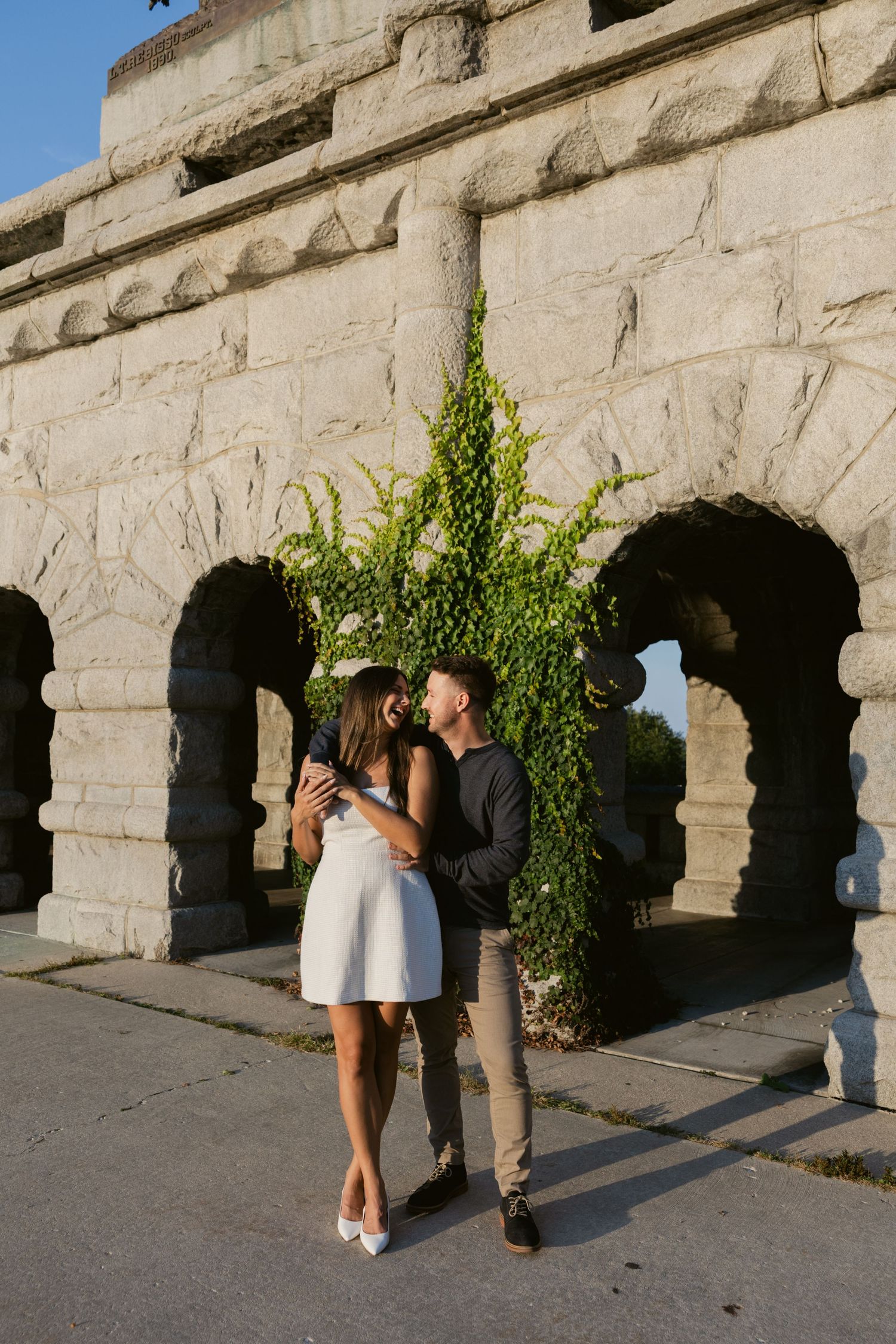 A romantic sequence of images showing a couple embracing against a stone archway wall on a sunny afternoon.