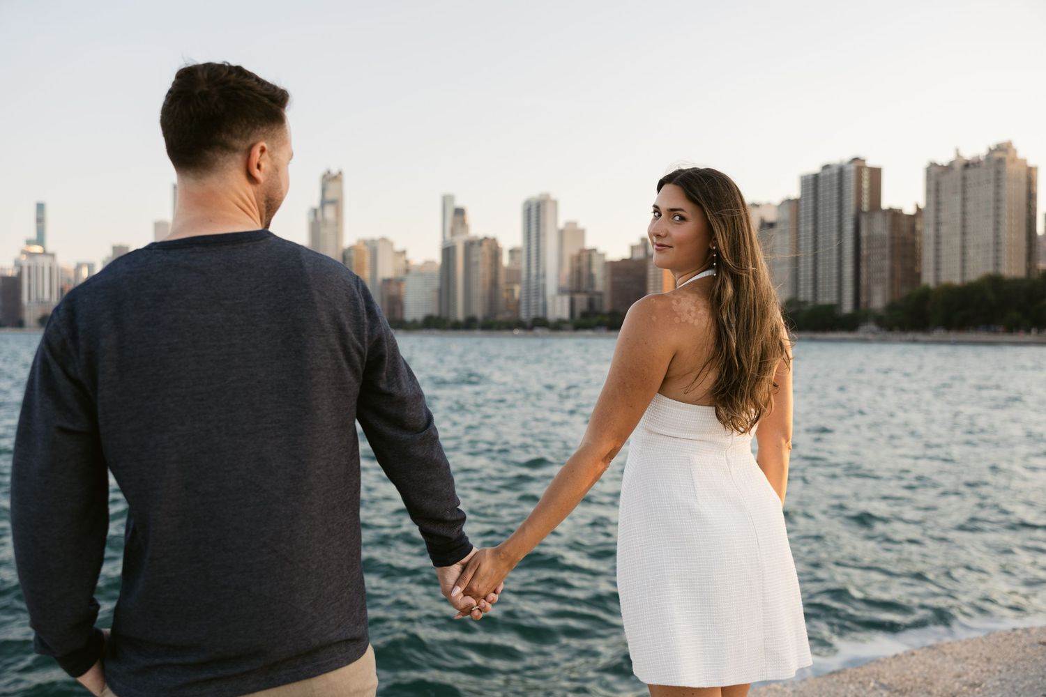 Scenic Chicago skyline view across Lake Michigan during golden hour.