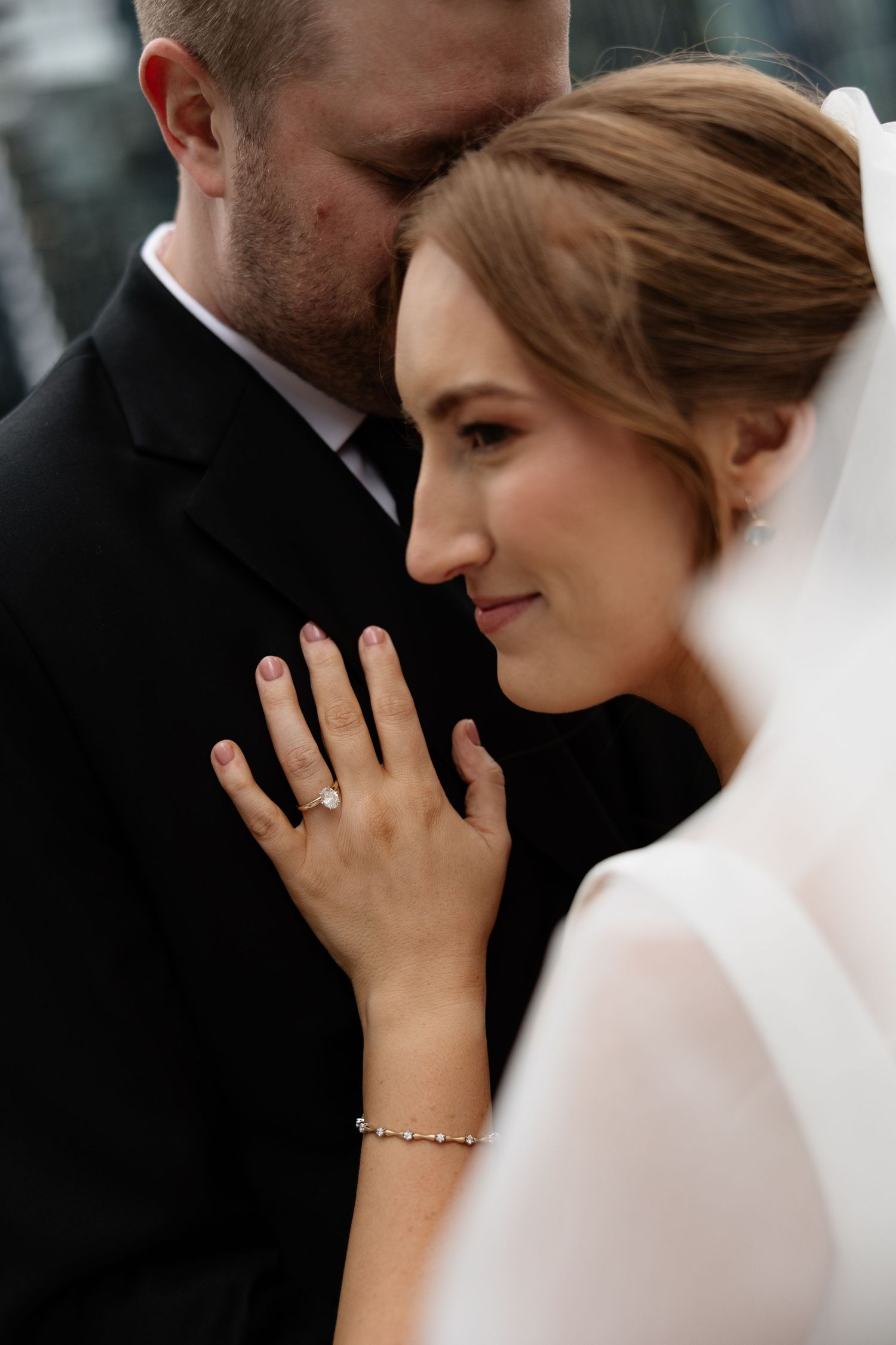 Intimate wedding portraits showcase tender moments between newlyweds with elegant details.
