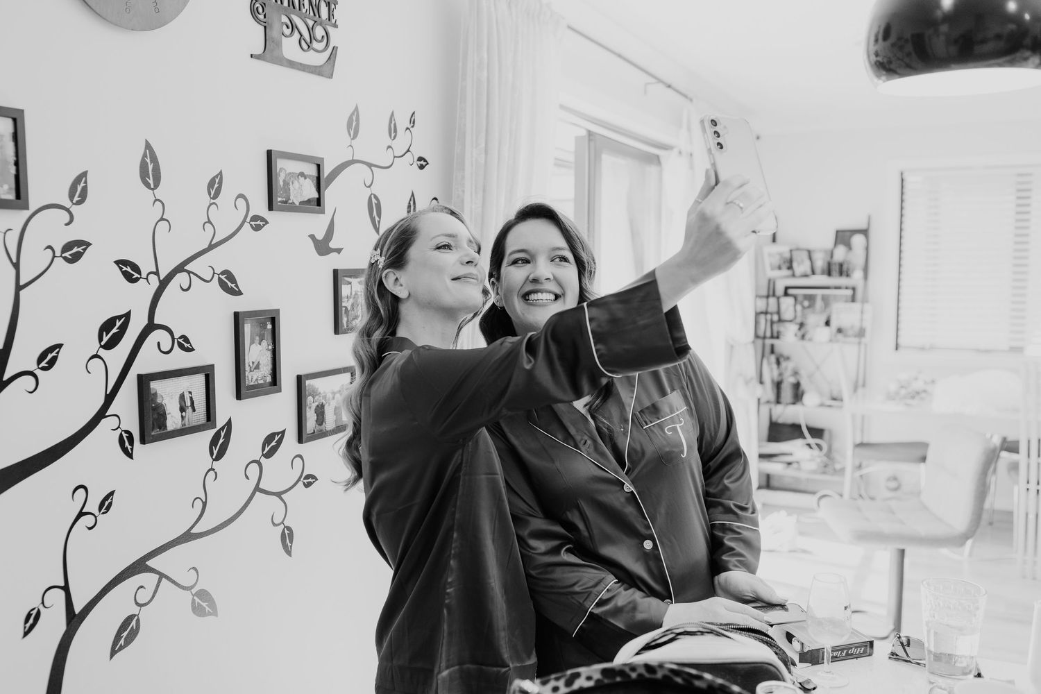 Interior photo sequence showing casual interactions in a room with wall art.