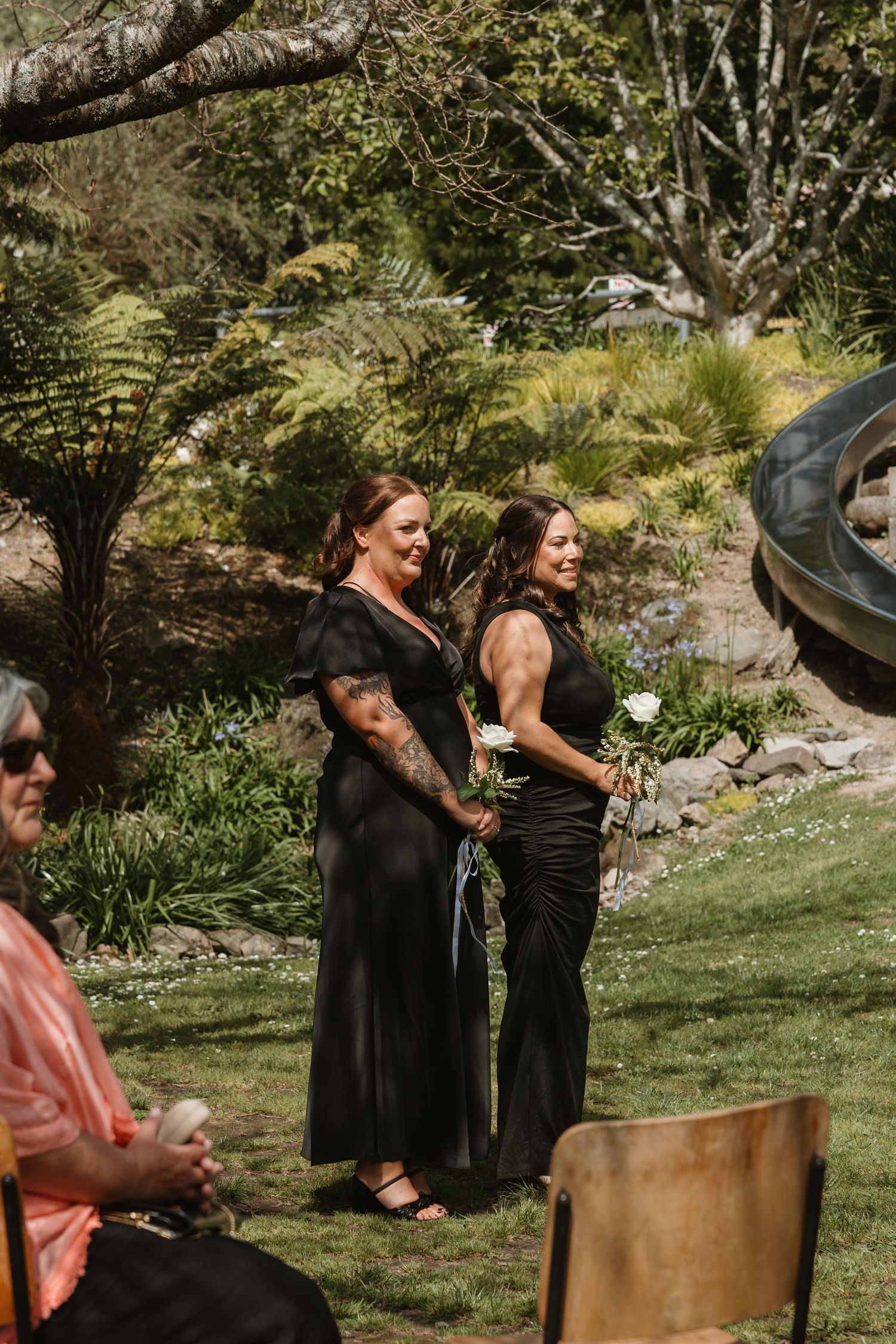 A sequence of photos showing people laughing and falling off chairs in an outdoor garden setting.