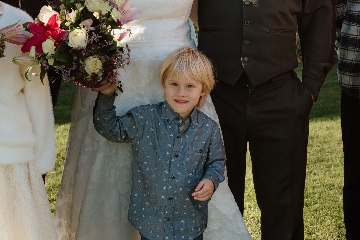 A gallery of five wedding photos featuring elegant floral arrangements and outdoor garden setting at sunset.