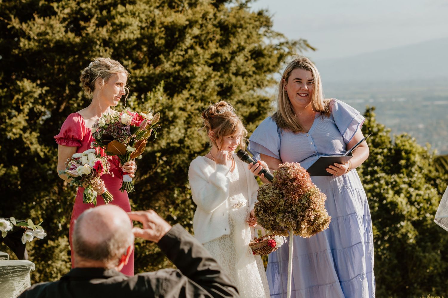 A series of outdoor wedding images showing celebratory moments and bouquet toss against a scenic mountain backdrop.