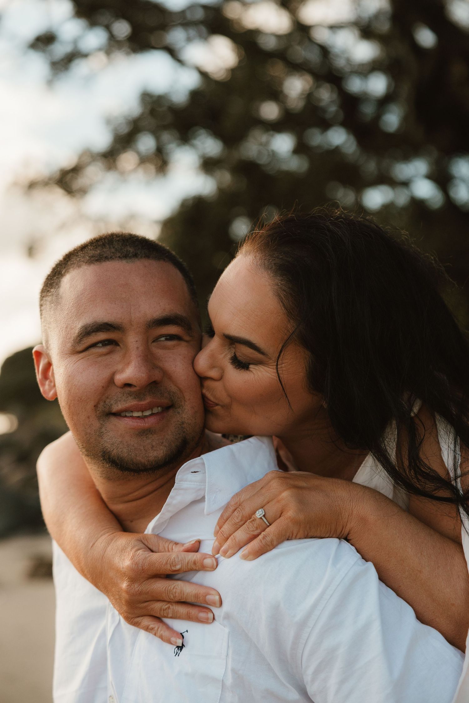 A loving couple shares tender moments in a series of romantic outdoor photos with natural lighting and soft bokeh.