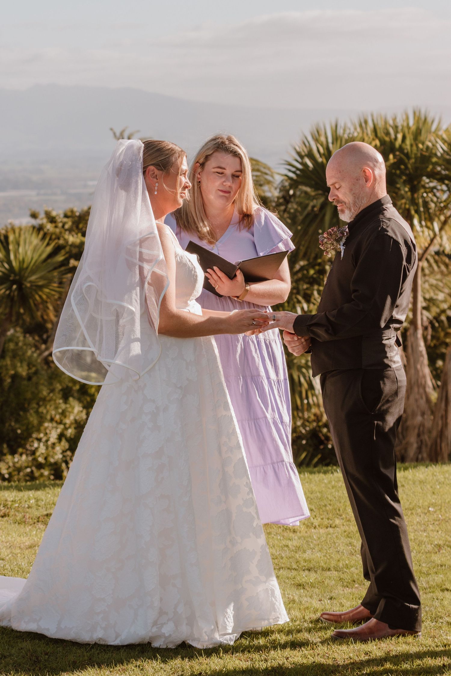 A series of photos showing a couple's outdoor wedding ceremony with a beautiful palm tree backdrop.