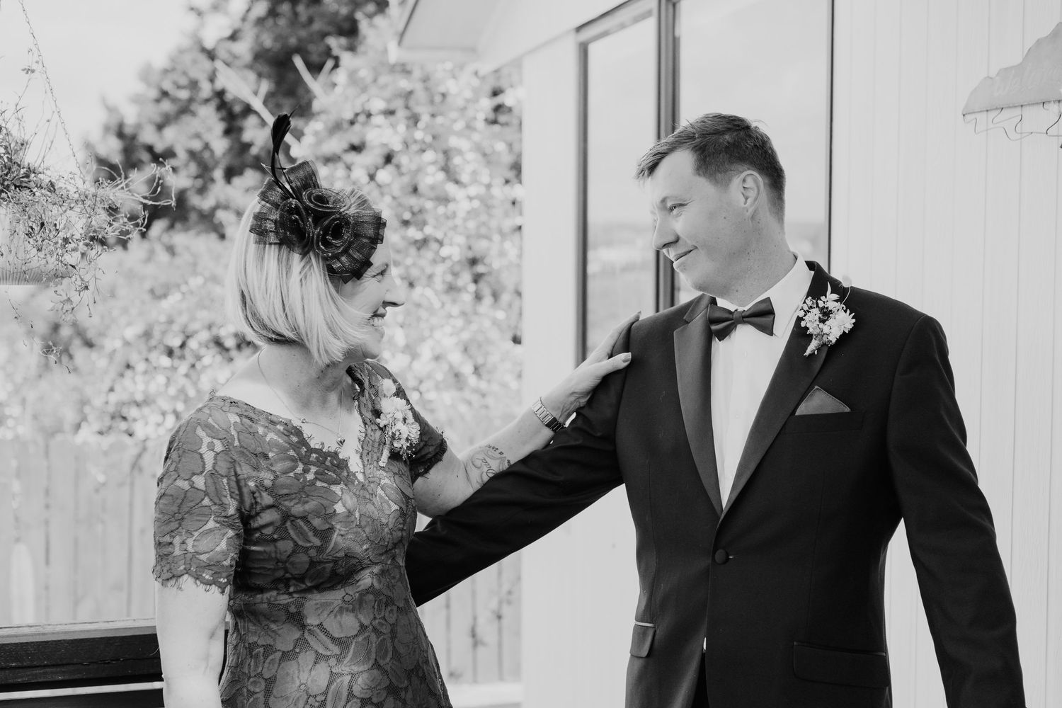 A collection of black and white wedding photos showing joyful moments between couples at romantic celebrations.