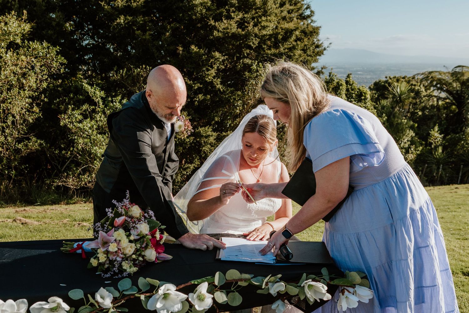 Family members gather outdoors on a sunny day to share special moments together in nature.