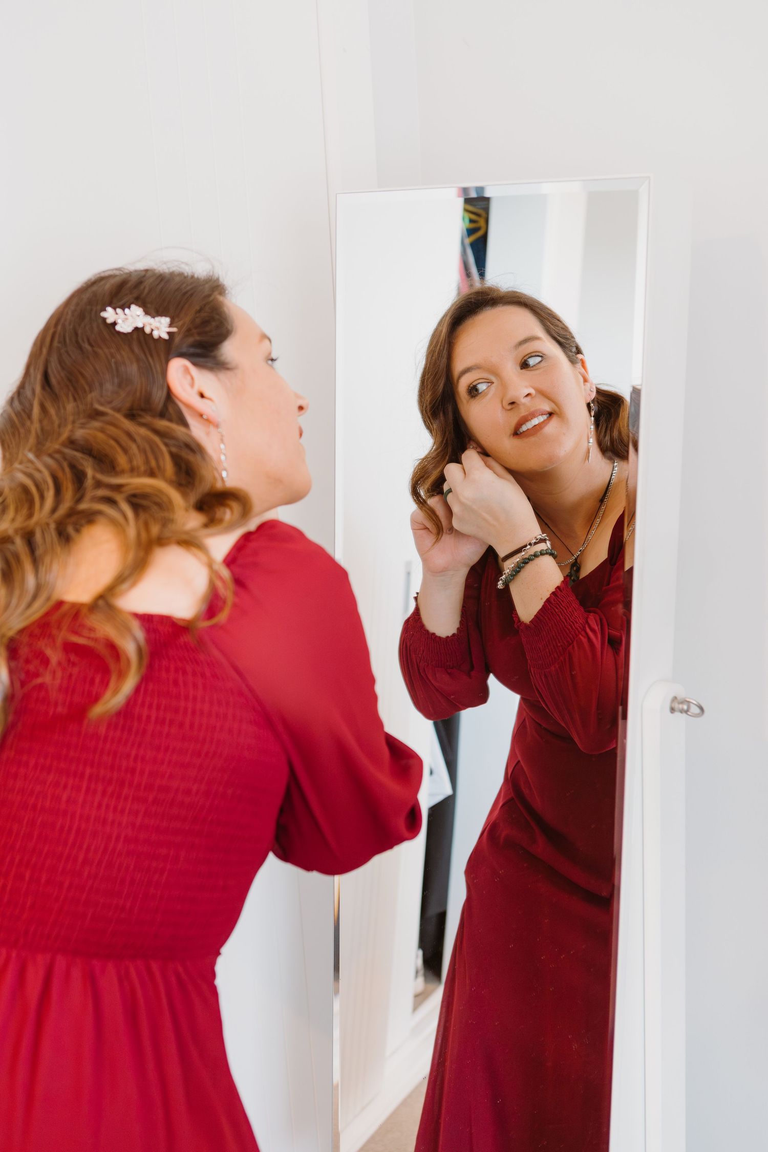 Person in deep red dress making animated expressions in a sequence of shots.