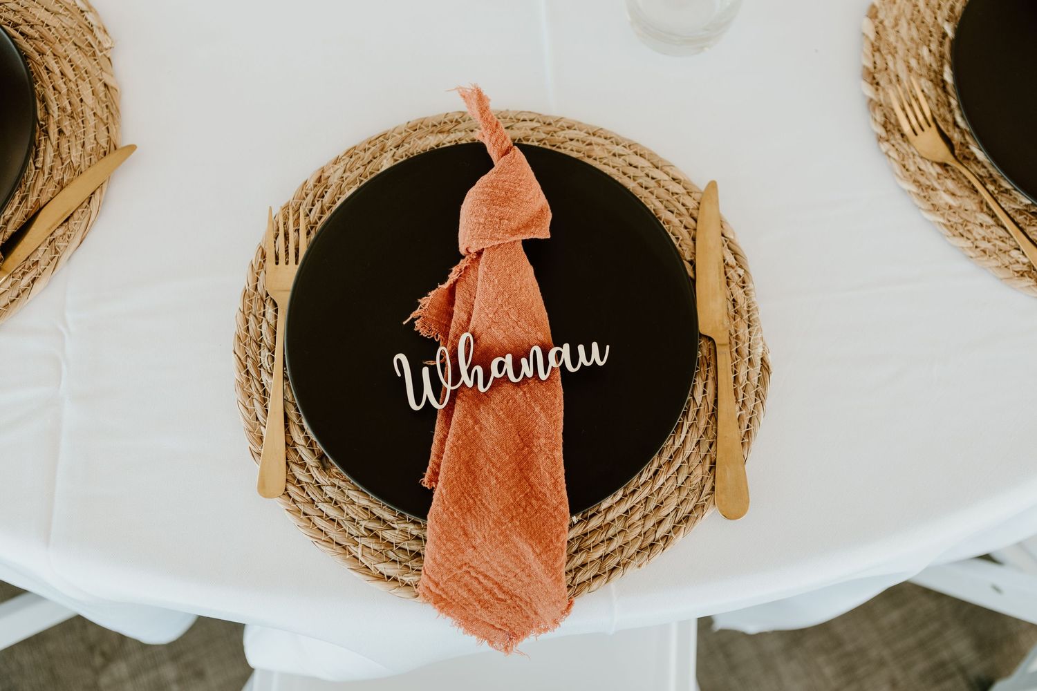 Woven round wicker basket tops arranged in a linear pattern against a white background with terracotta accents.