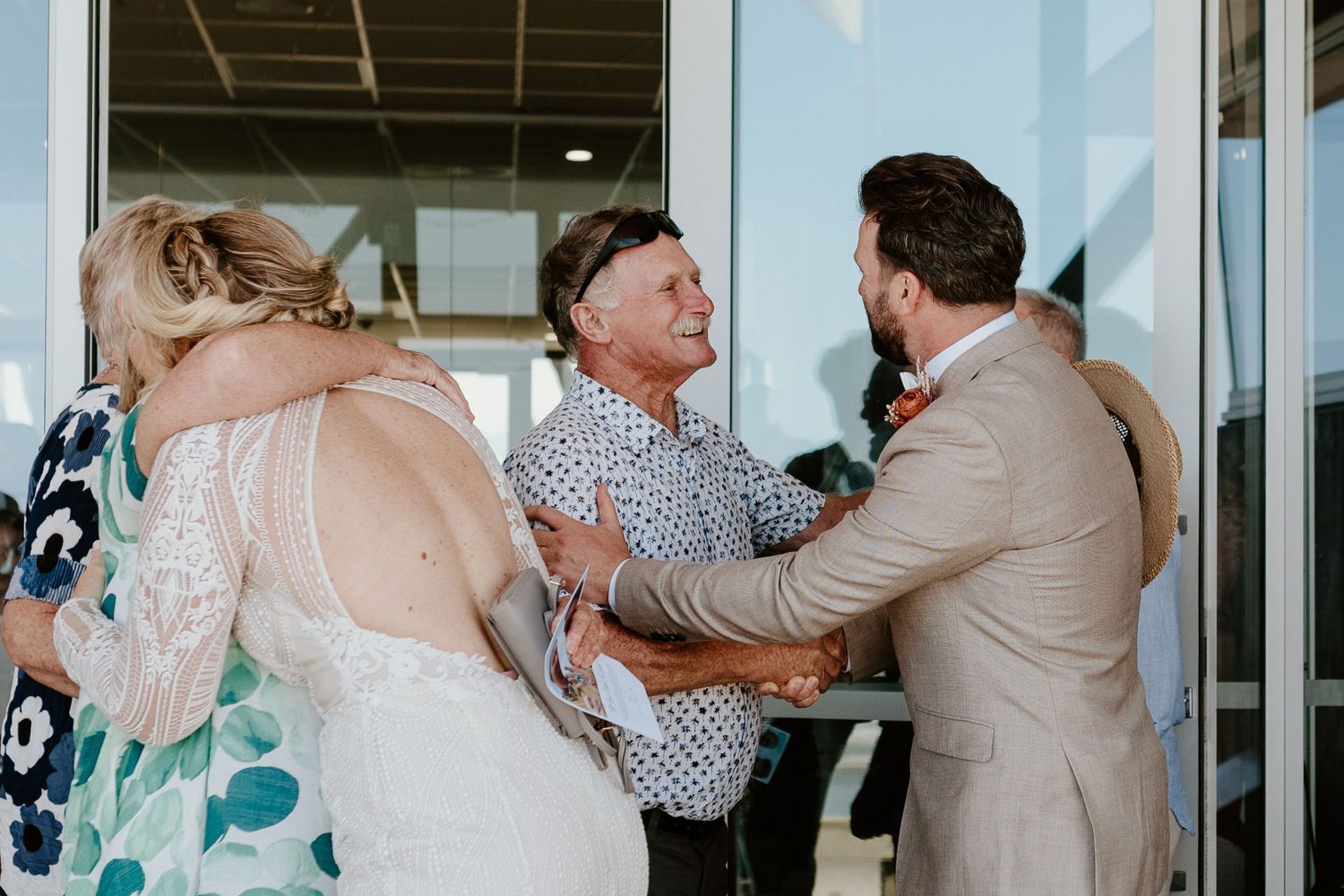 Tender wedding reception moments shared between guests and wedding party indoors. Papamoa Beach Wedding