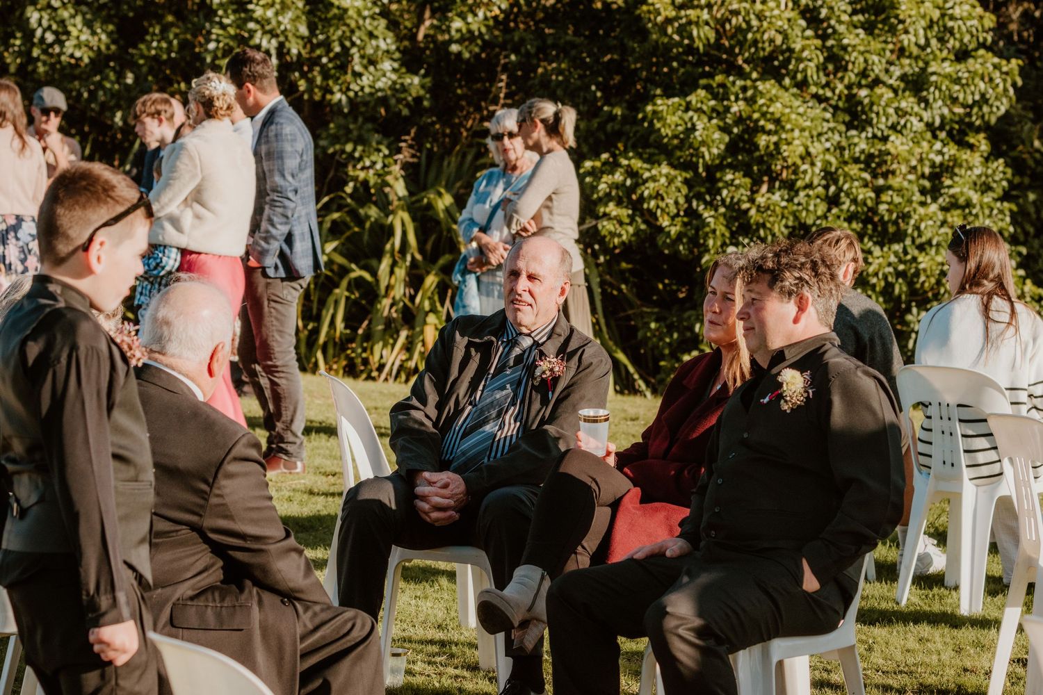 A series of candid outdoor wedding moments captured in a rustic garden setting during golden hour sunlight.