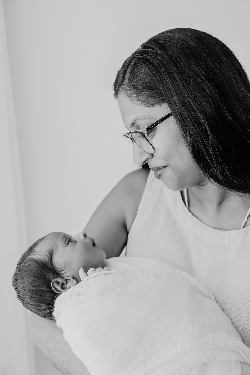 A tender black and white portrait of nurturing moments.