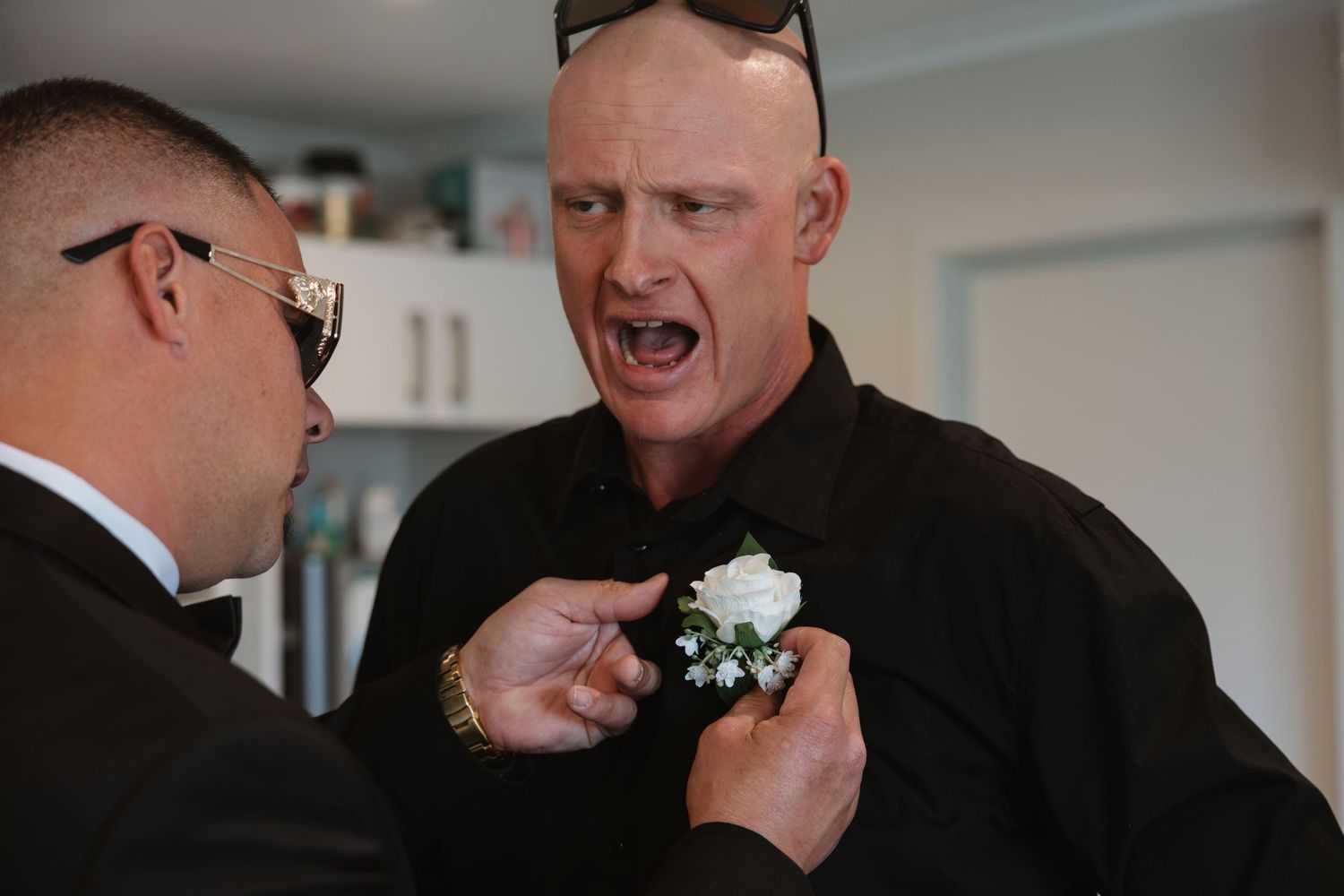 A series of emotional wedding moments captured in black and white showing tender embraces and joyful reactions.