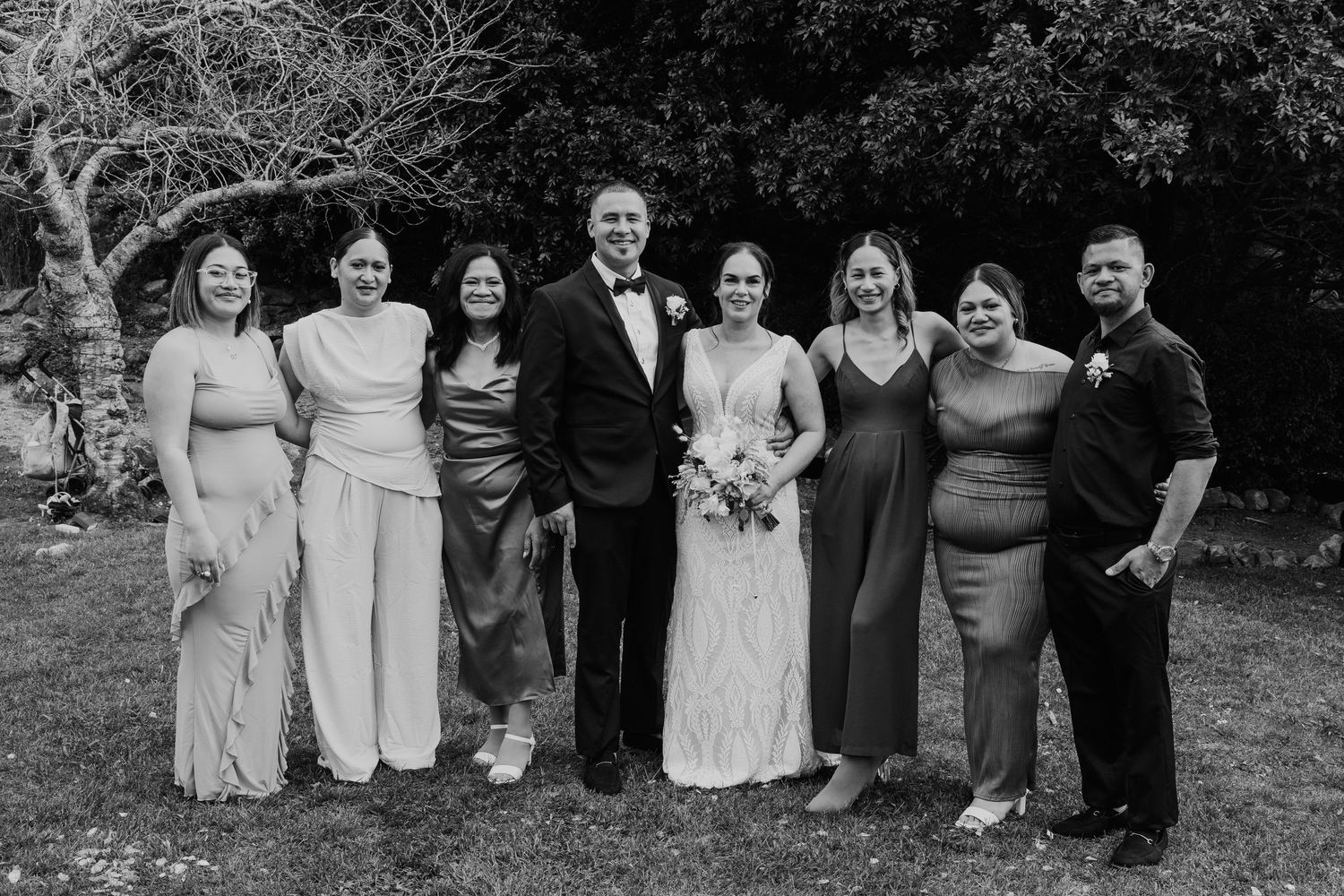 A black and white collage of wedding party group photos arranged in a horizontal strip.