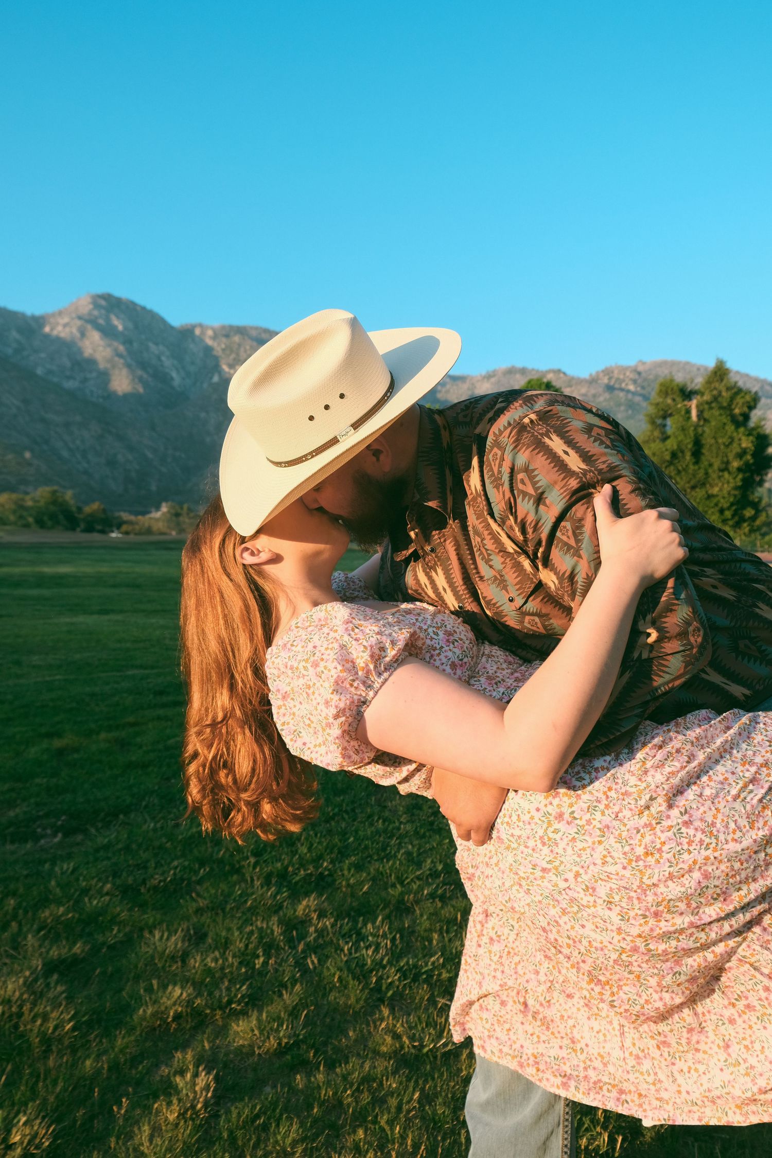 A playful dance sequence in a mountain meadow during golden hour.
