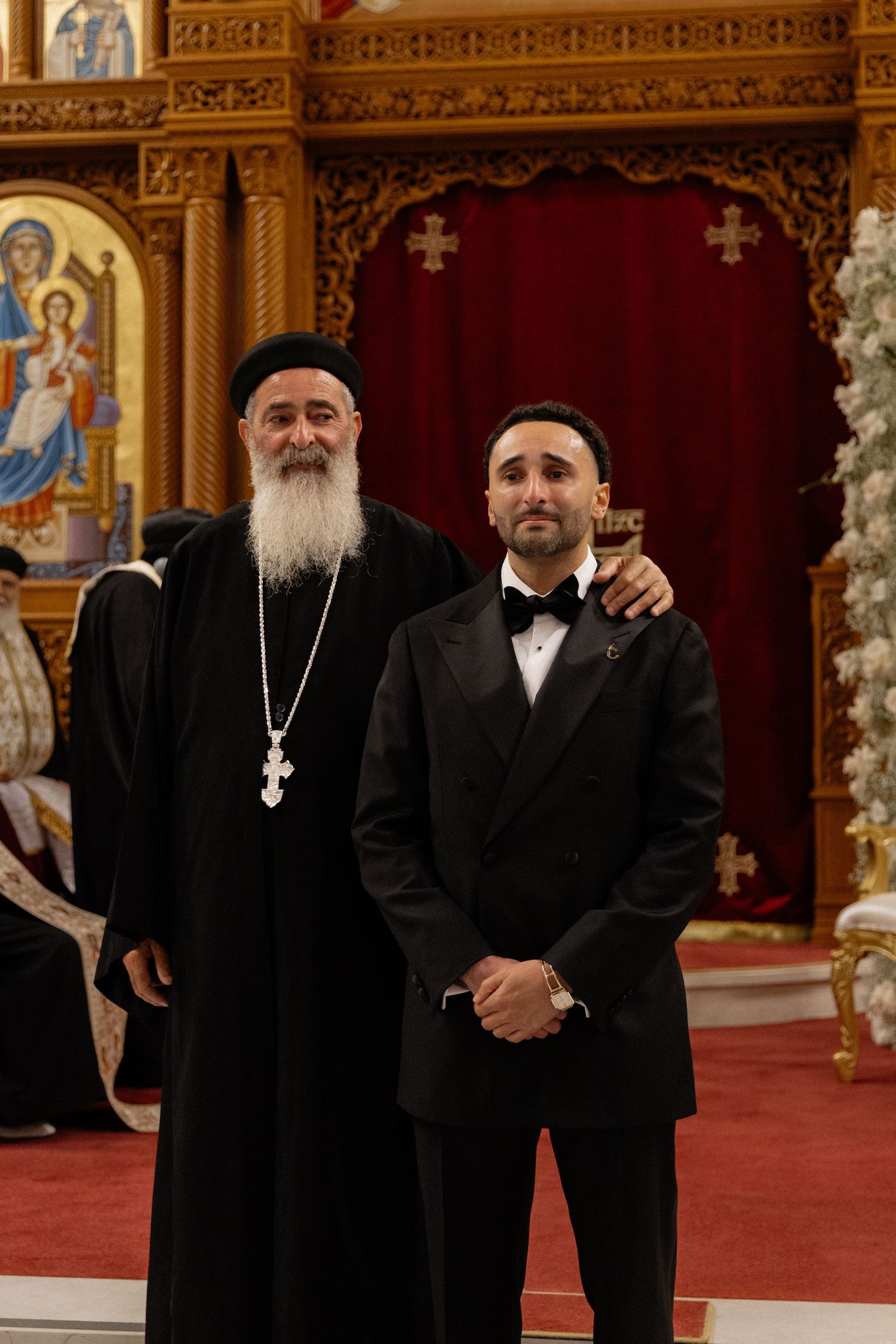 Groom with priest after the ceremony, captured by a small wedding photographer Southern California