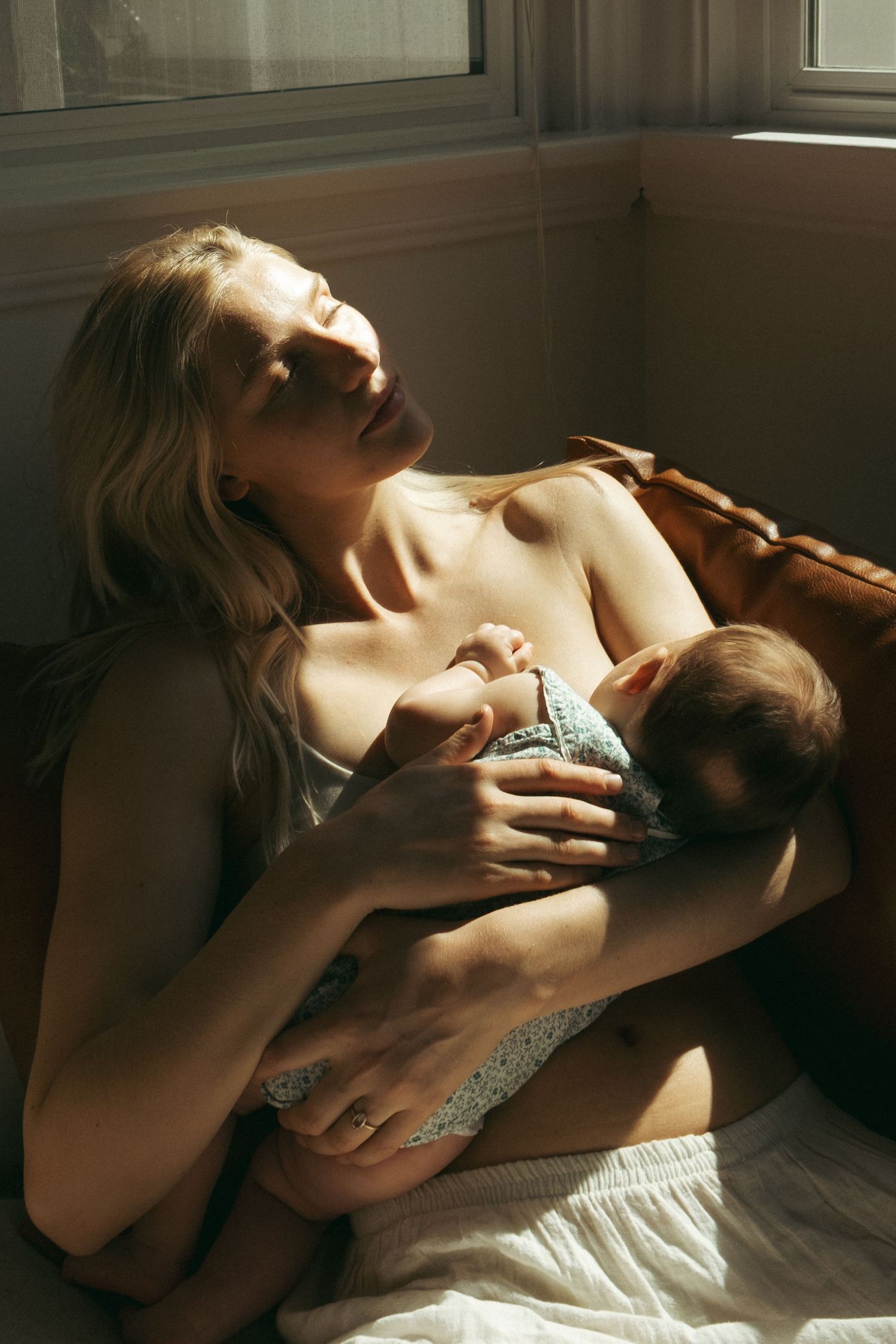 Intimate photography sequence bathed in dramatic natural window light.