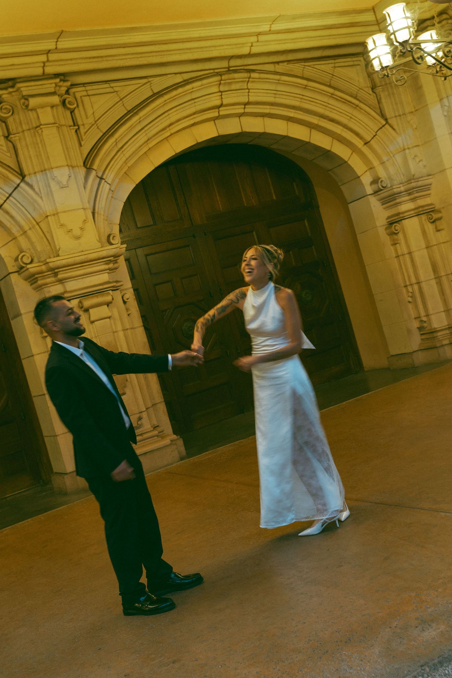 Romantic dance sequence in a vintage-style ballroom with warm lighting.